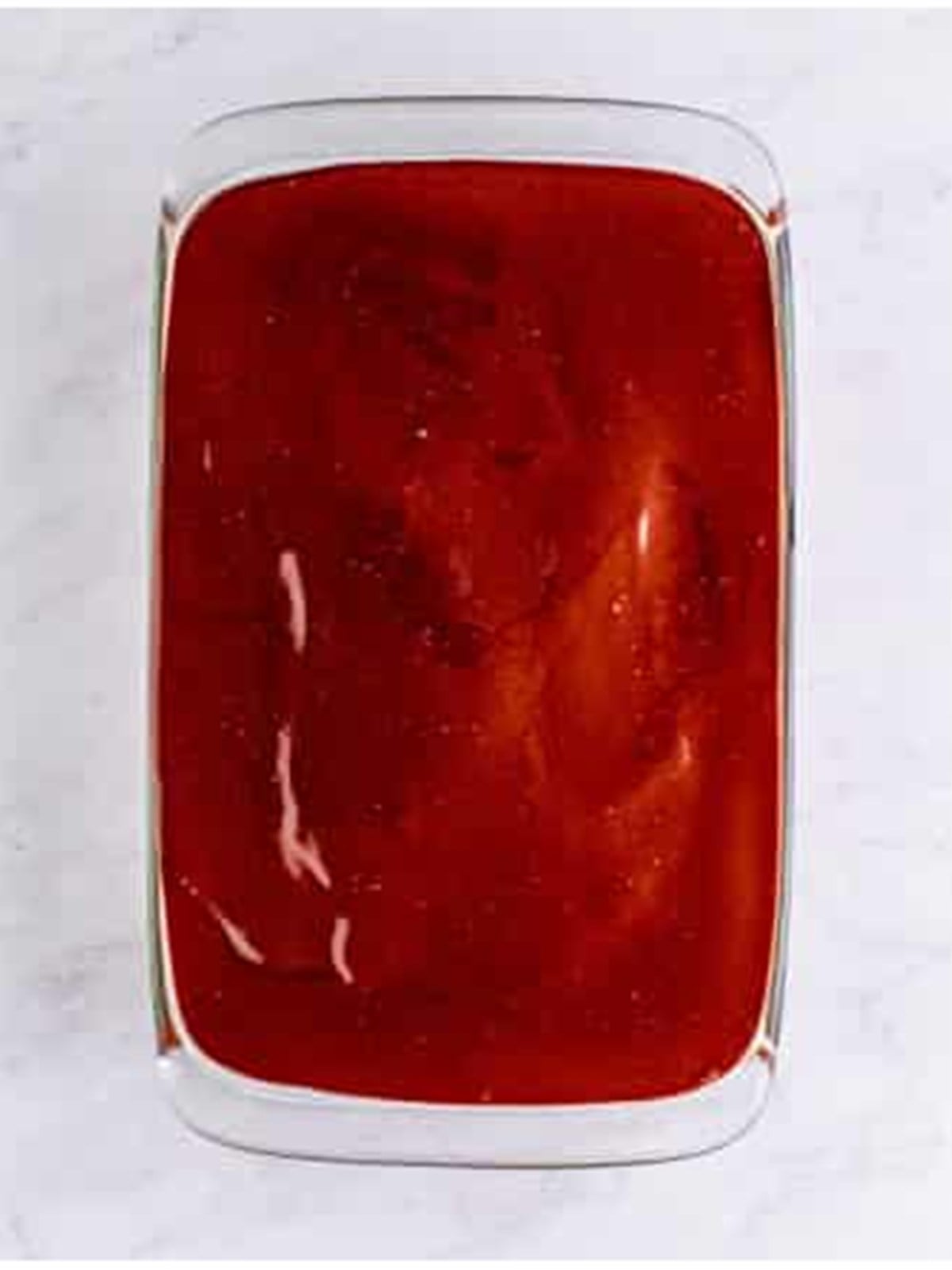 Chocolate ganache poured over the filling to finish the ding dong cake.