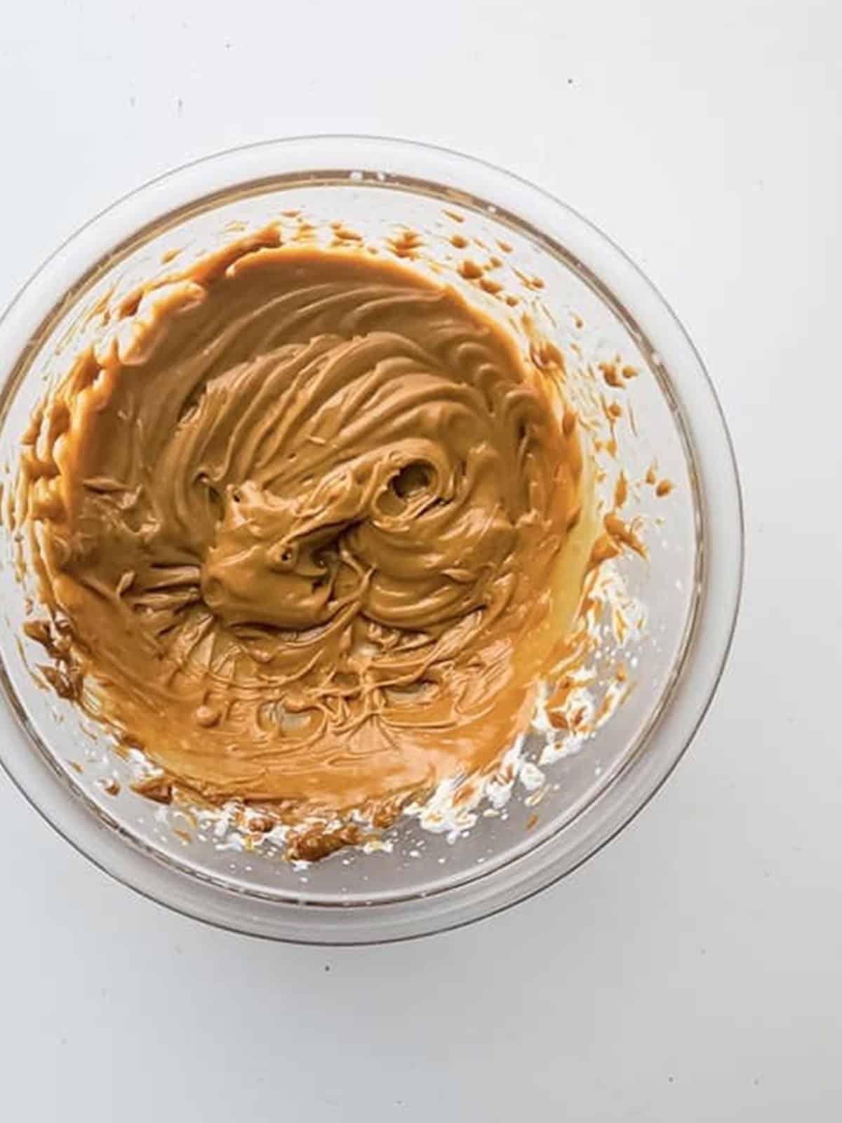 Whipped dulce de leche caramel topping in a mixing bowl.