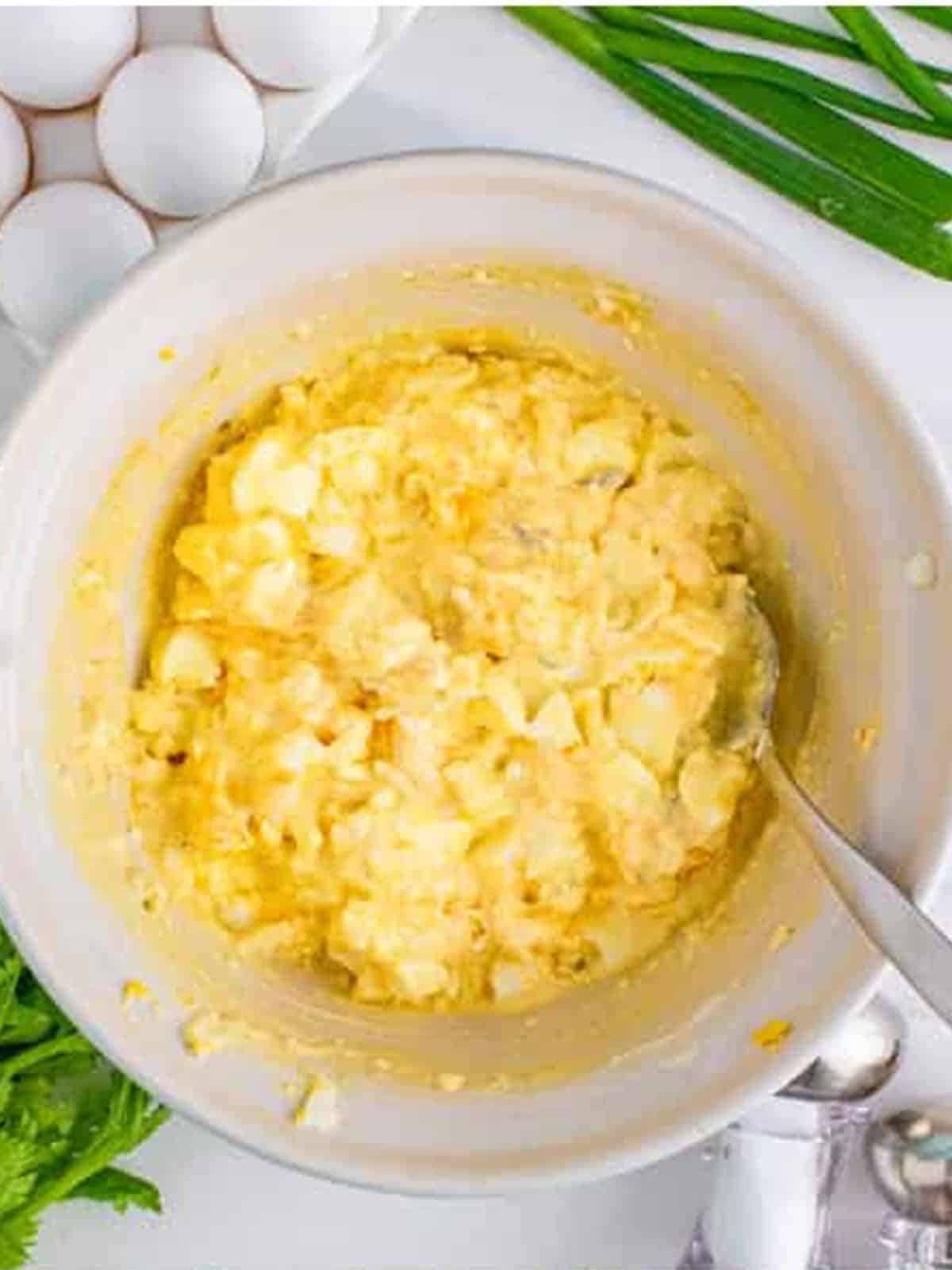 The egg salad mixed together until creamy and combined for egg salad sandwich.