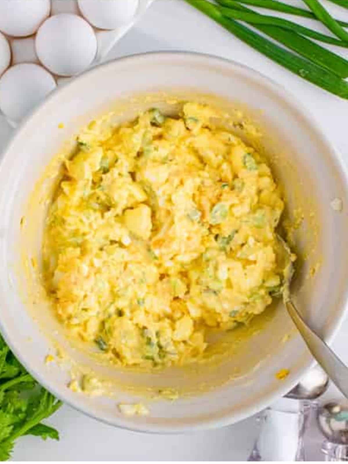The finished creamy egg salad folded together and ready to serve on bread.