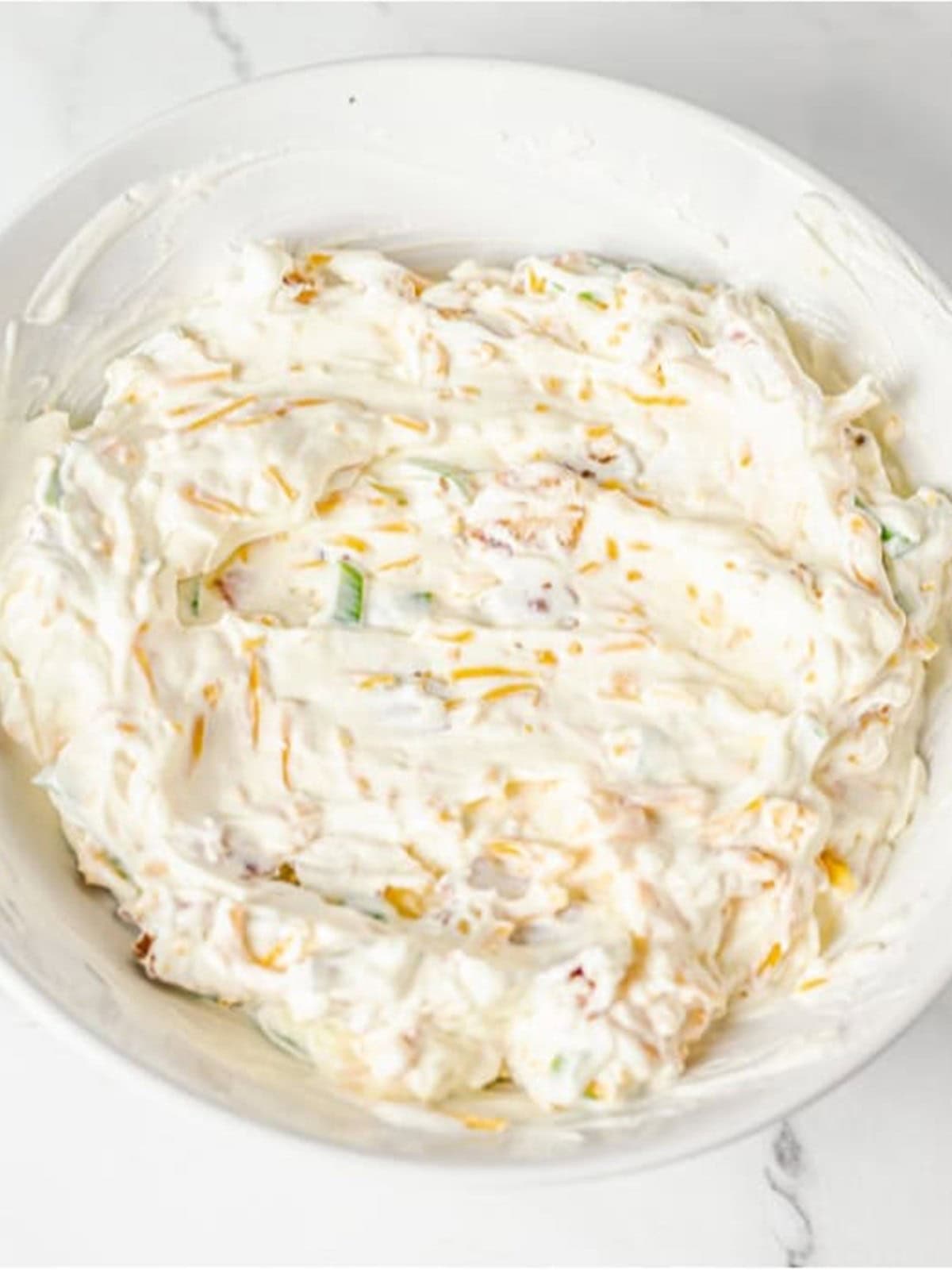 Cheddar cheese, scallions, and bacon stirred into the cream cheese mixture.