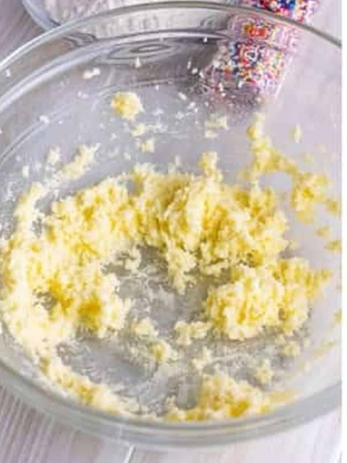 Creaming butter and sugar in a glass bowl for fairy cakes.