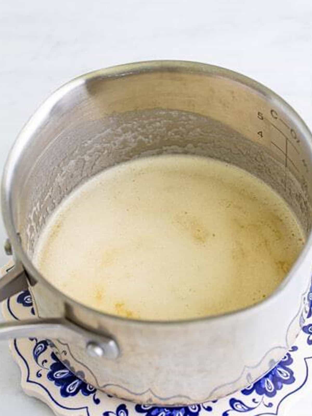 Butter melting in a saucepan to start the firecracker sauce.
