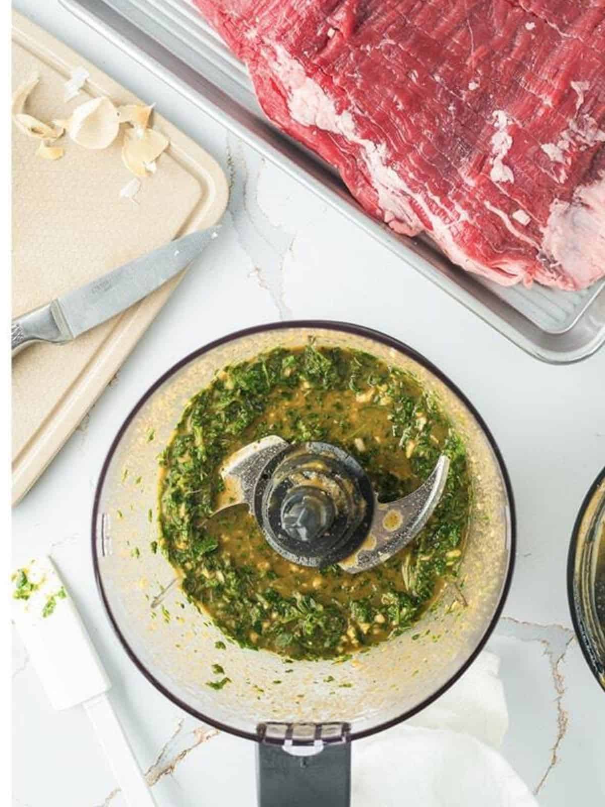 The chimichurri marinade blended into a thick green paste in the food processor.