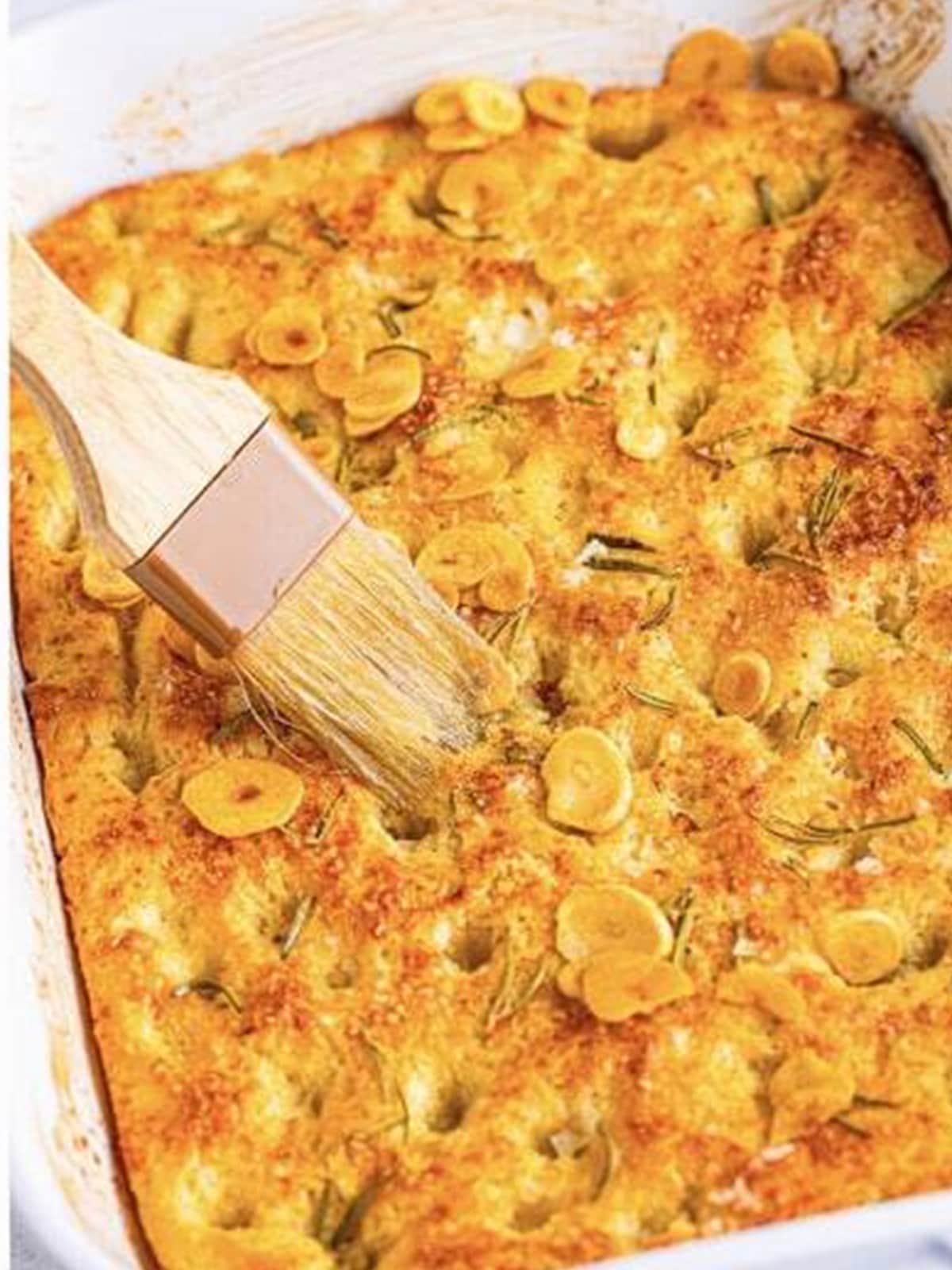 Baked garlic rosemary focaccia bread brushed with toasted garlic oil.