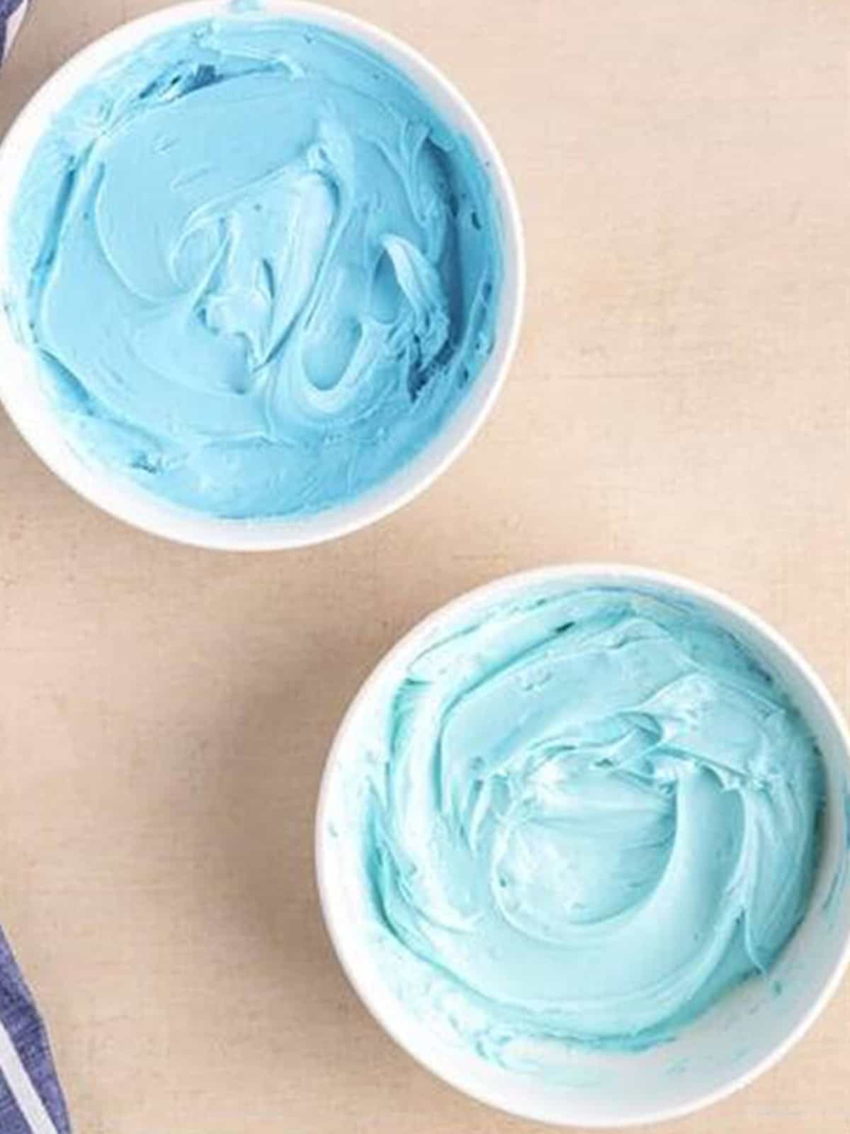 Frosting tinted into two shades of blue for the ombre smash cake.