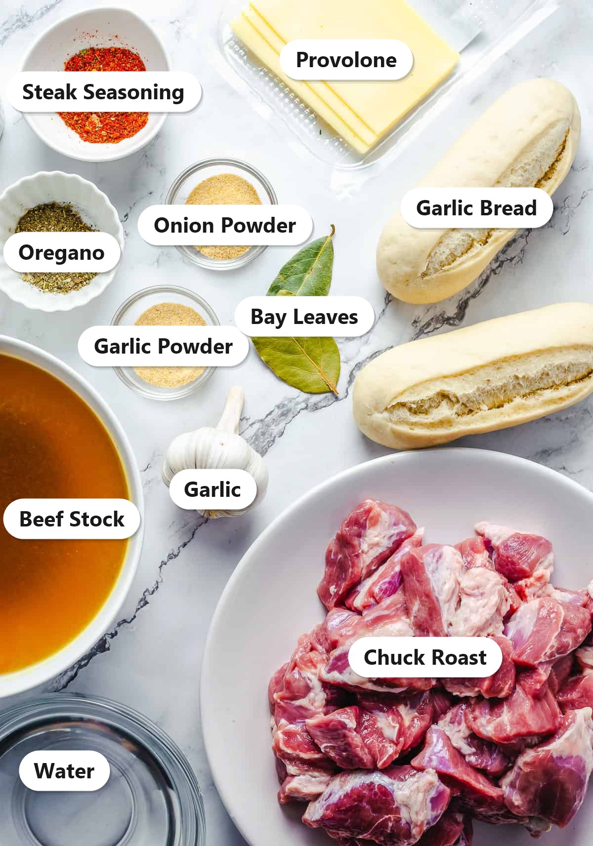 Crock pot french dip sandwich ingredients labeled on marble