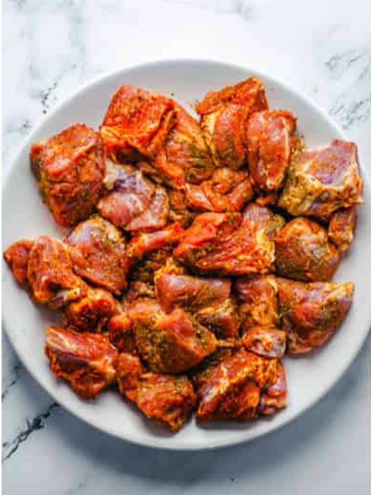 Chuck roast cut into chunks and seasoned for french dip
