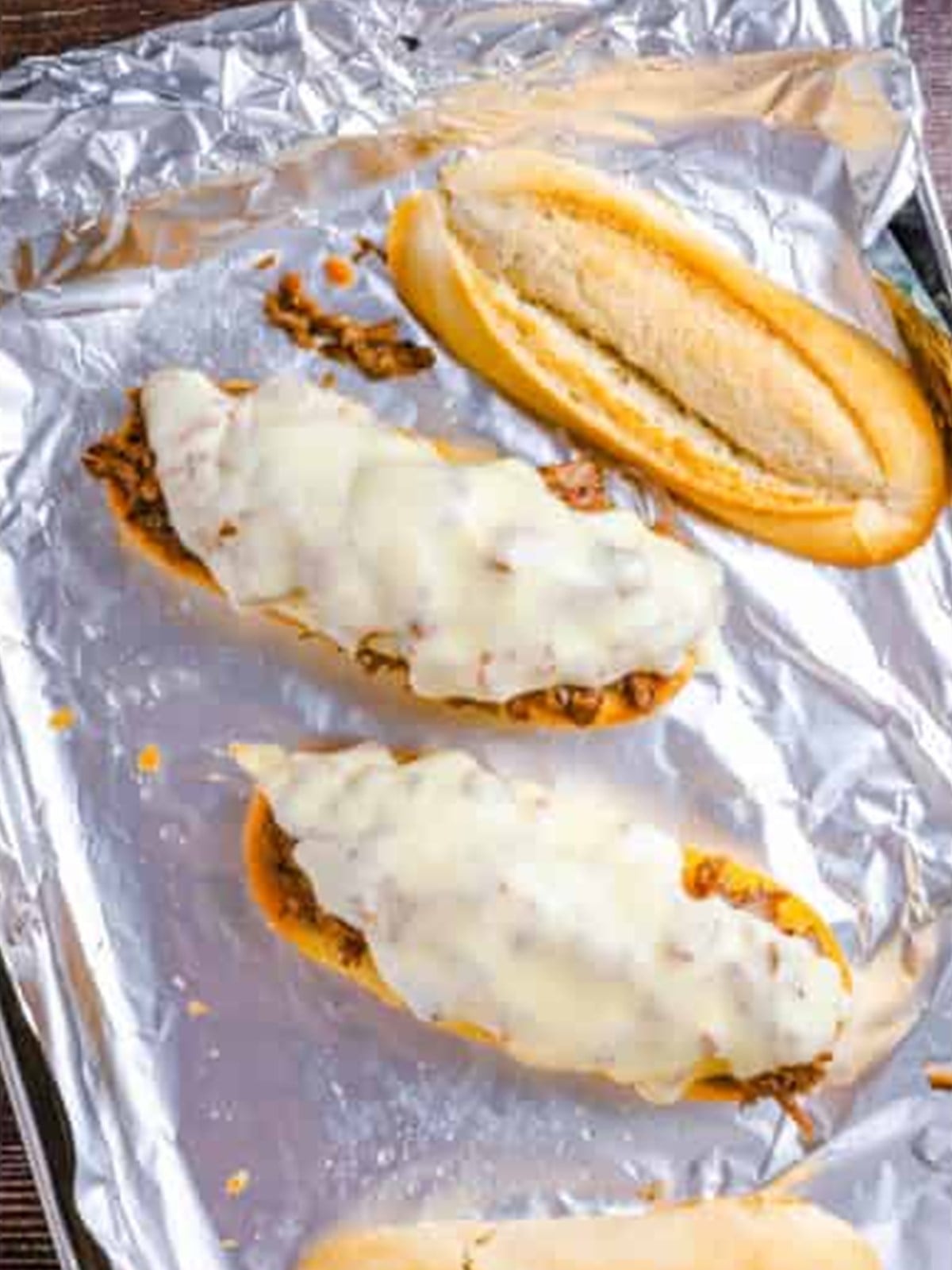 Beef piled on garlic bread topped with provolone