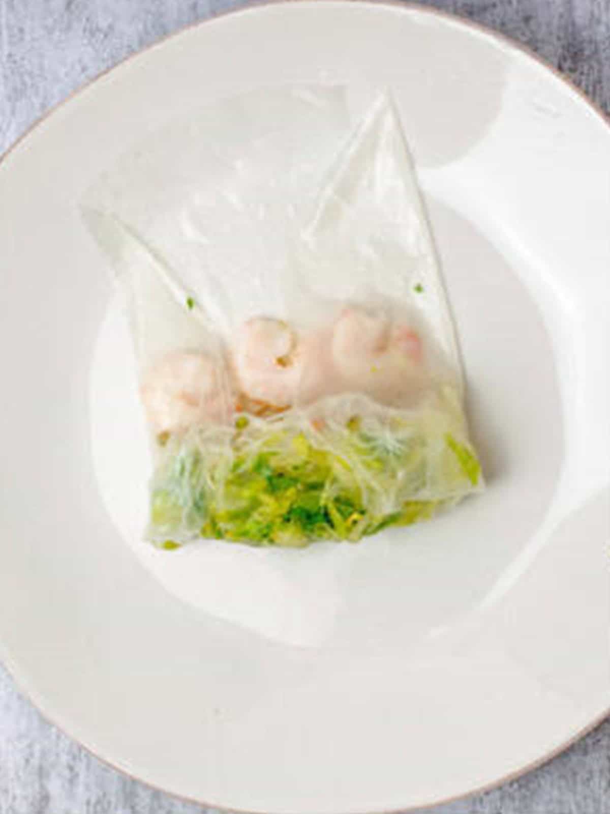 Sides of the rice paper wrapper folded in over the filling.