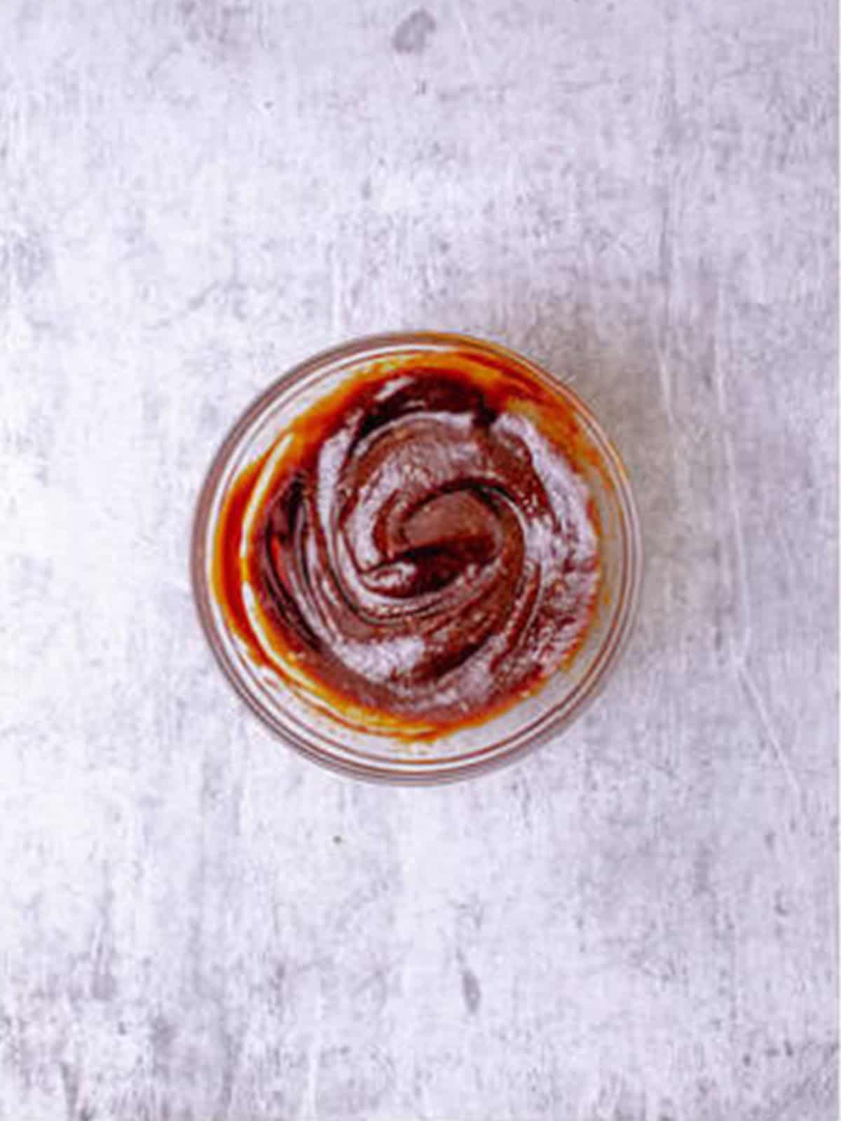 Hoisin peanut dipping sauce whisked together in a small bowl for fresh spring rolls.