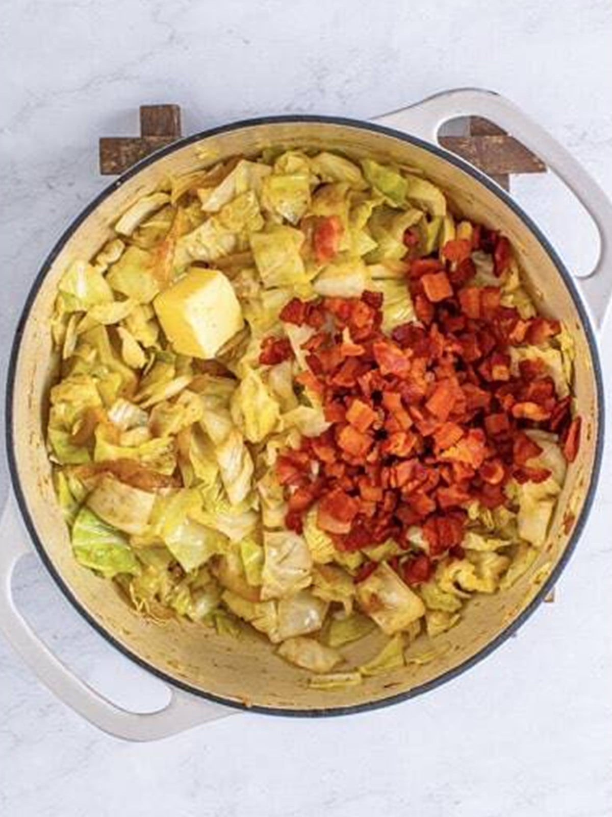 Crispy bacon and butter added back to the fried cabbage.