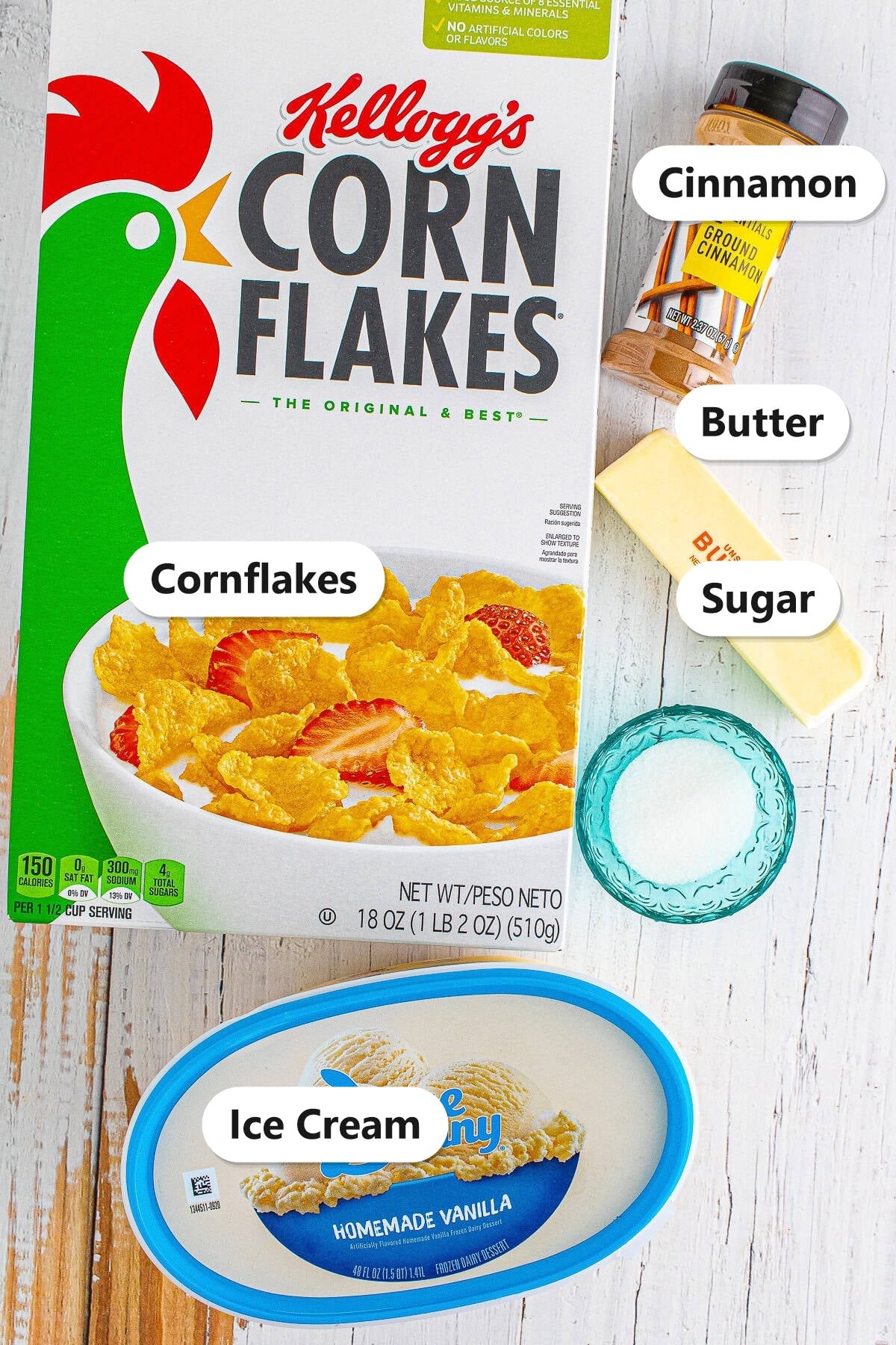 Labeled ingredients for fried ice cream including cornflakes, cinnamon, butter, sugar, and vanilla ice cream.