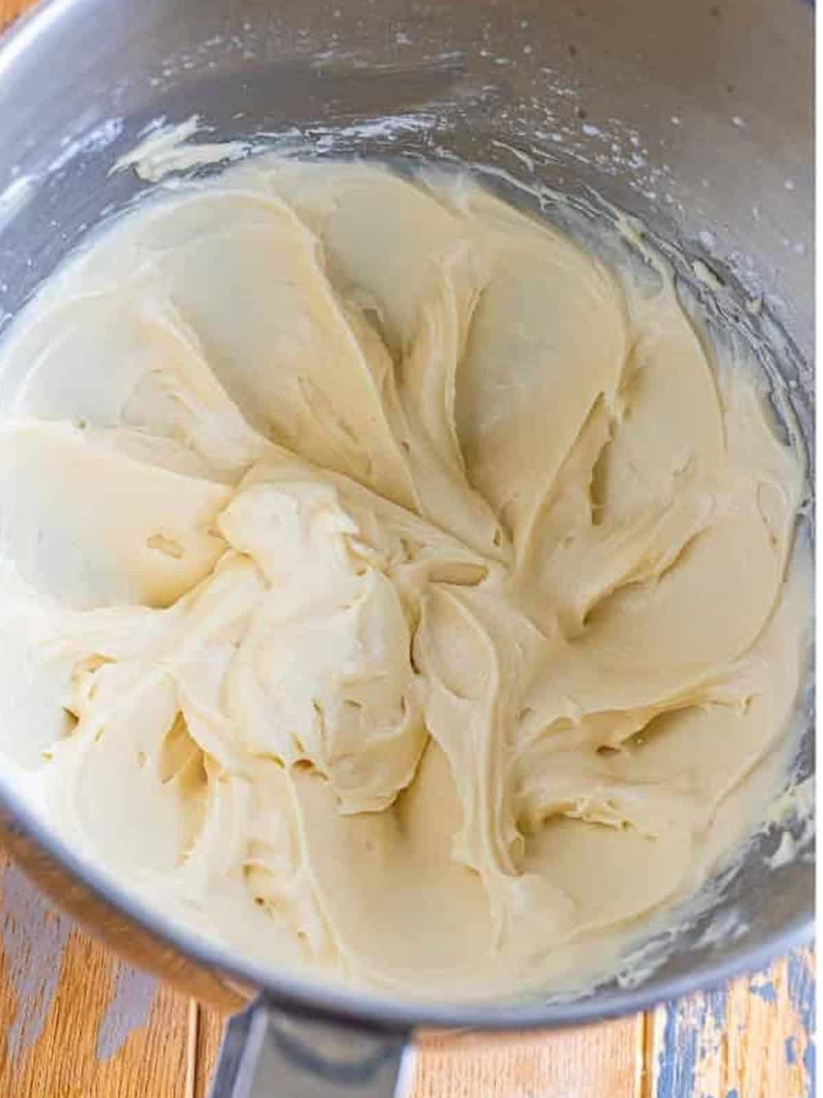 Smooth, creamy whipped cream cheese and powdered sugar mixture in a bowl.