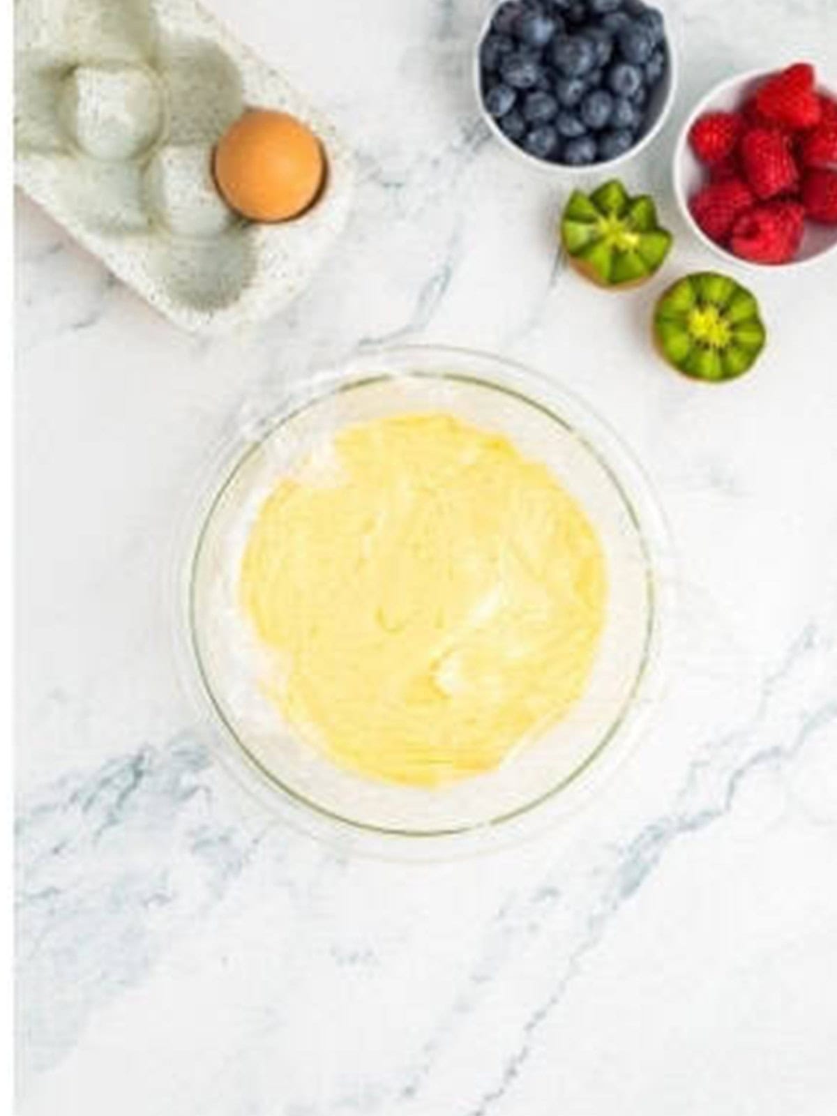 Finished pastry cream cooling in a bowl for mini fruit tartlets.