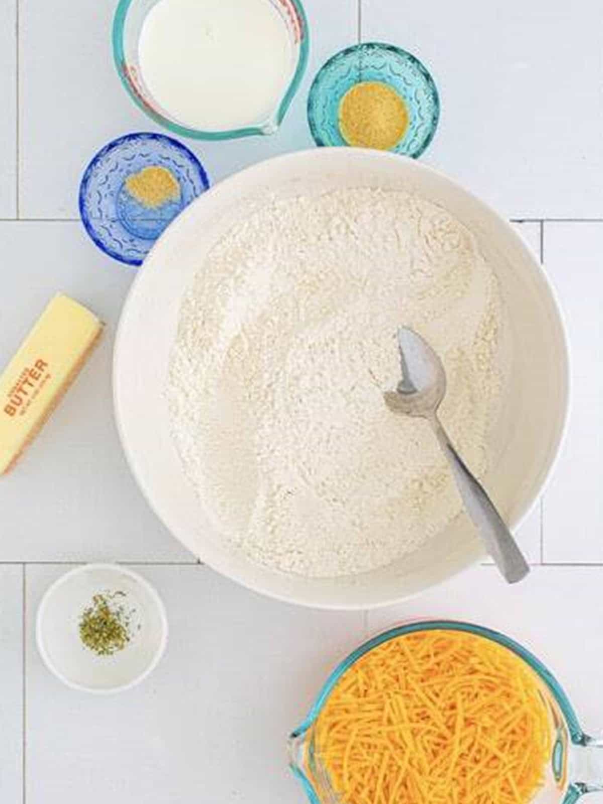 Flour, sugar, baking powder, and salt whisked together in a large bowl.
