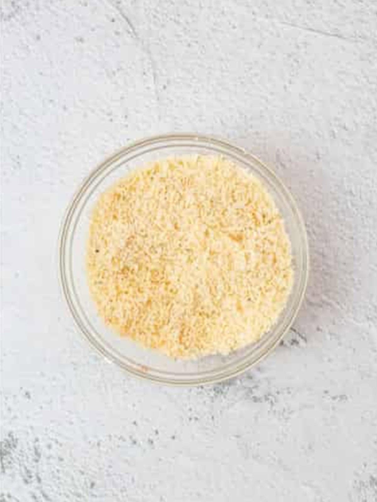 Grated parmesan and seasonings mixed together in a bowl for the garlic parmesan wings coating.
