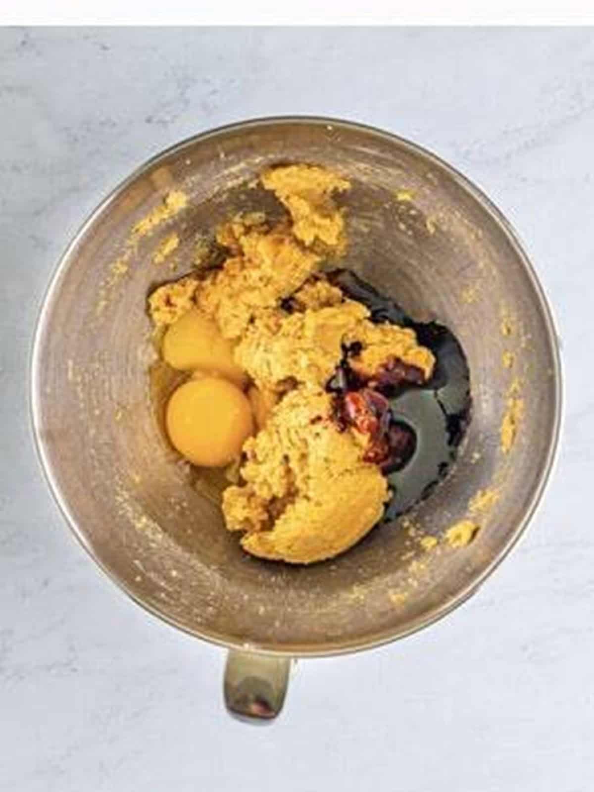 Eggs, molasses, and vanilla added to the creamed butter and sugar.