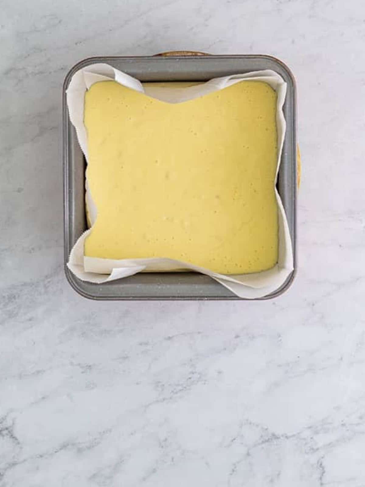 Cheesecake filling poured over the Golden Oreo crust and smoothed in the pan.
