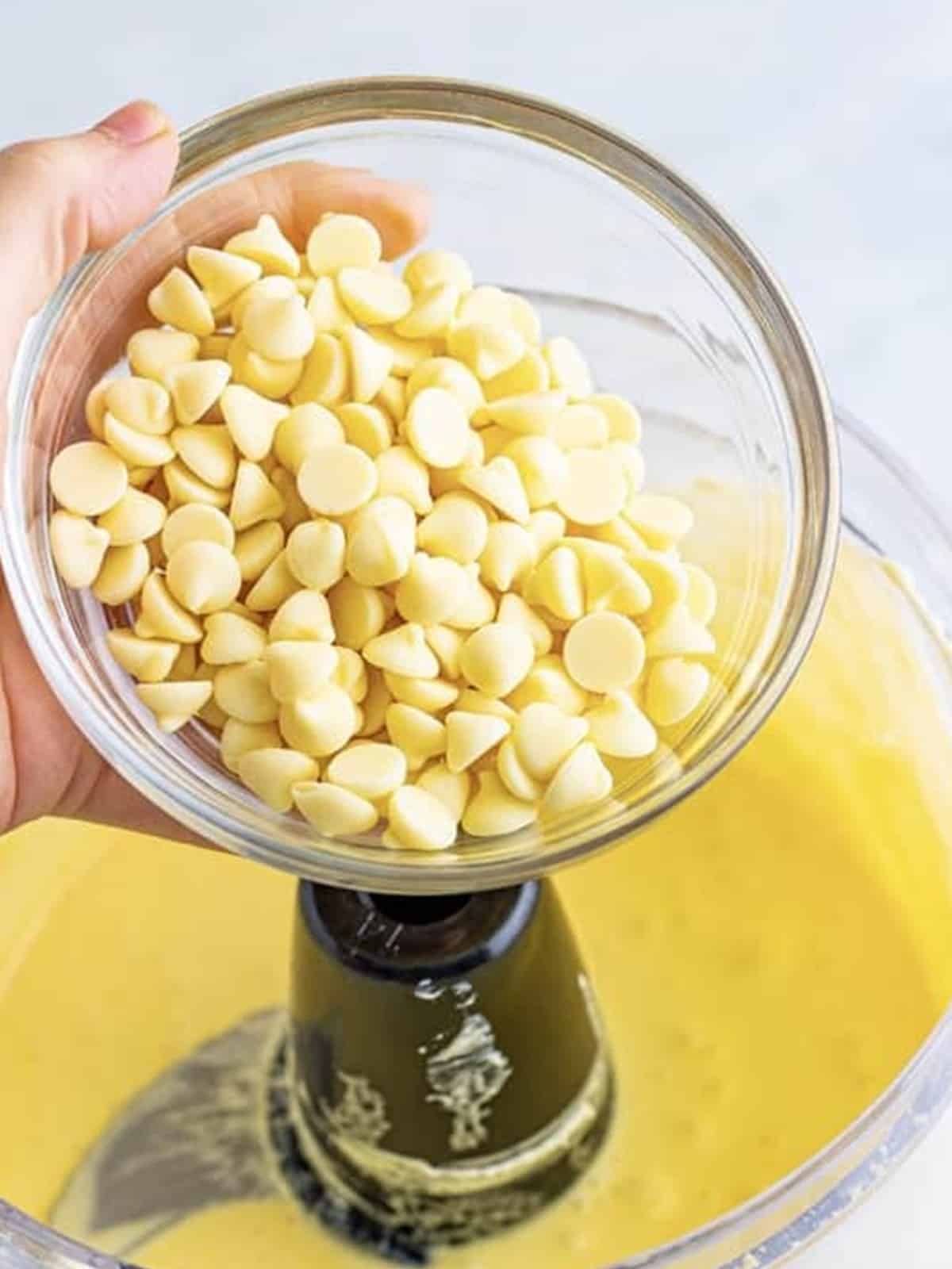 White chocolate chips added to the cheesecake filling in the food processor.