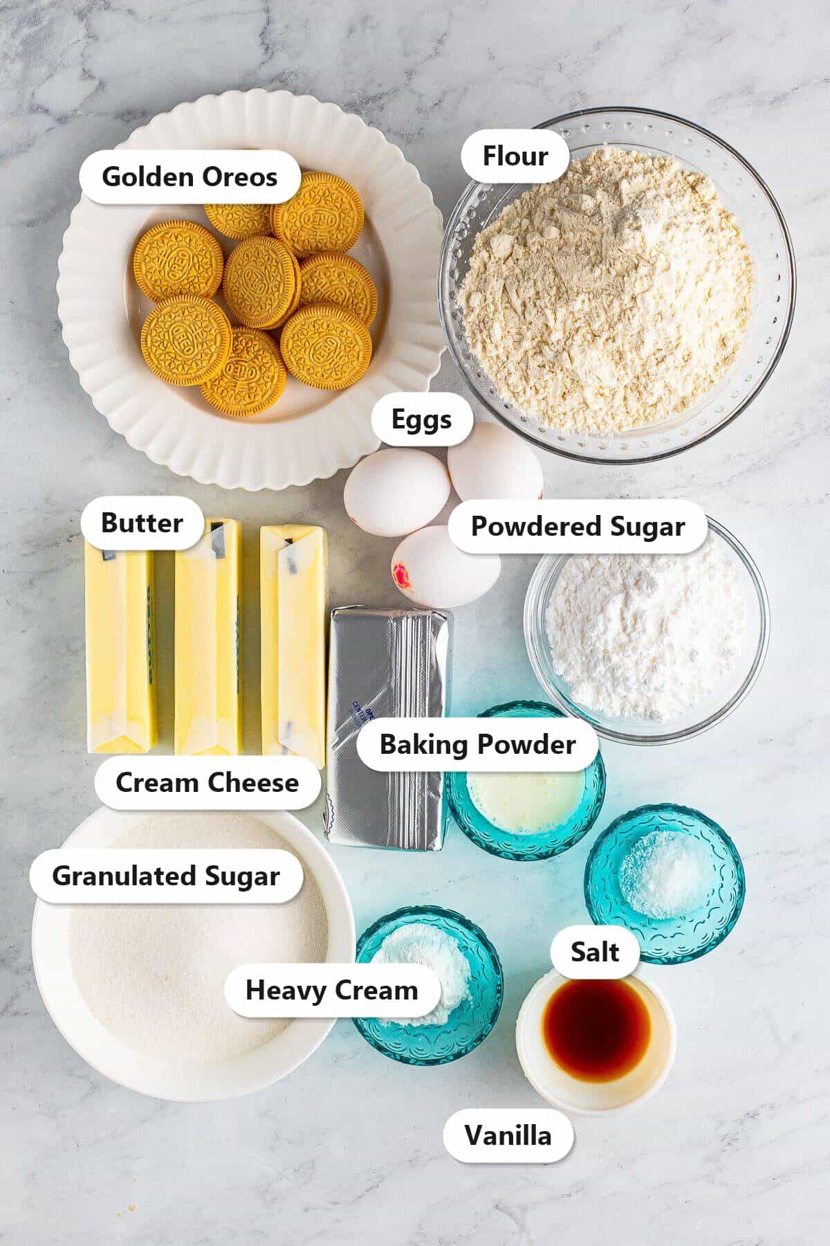 Labeled ingredients for copycat Crumbl golden Oreo cookies including golden Oreos, flour, butter, sugar, eggs, cream cheese, and powdered sugar.