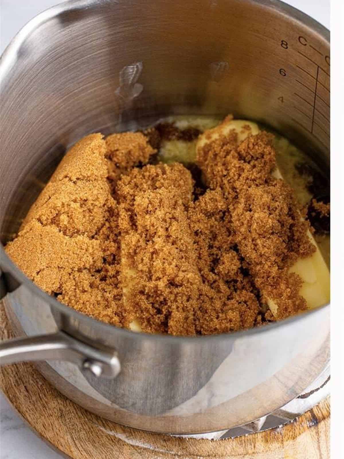 Butter and brown sugar melting together in a saucepan for toffee.