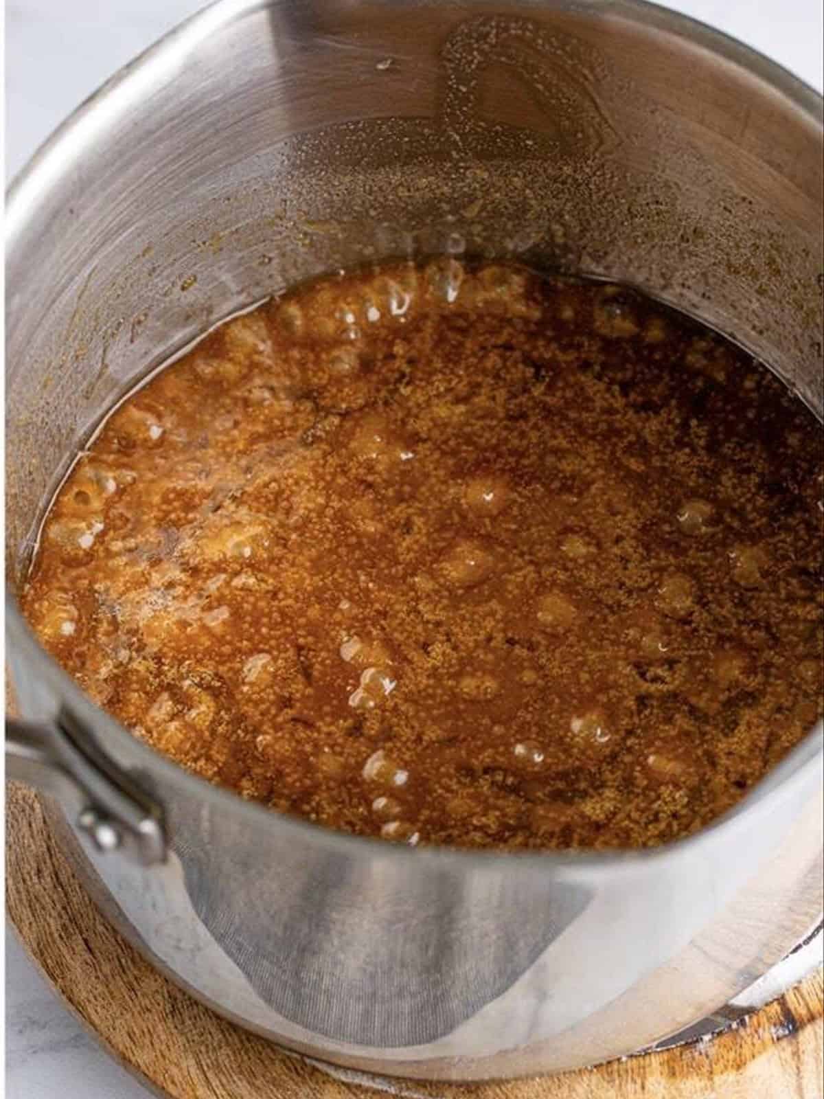 The brown sugar toffee mixture boiling in the saucepan.