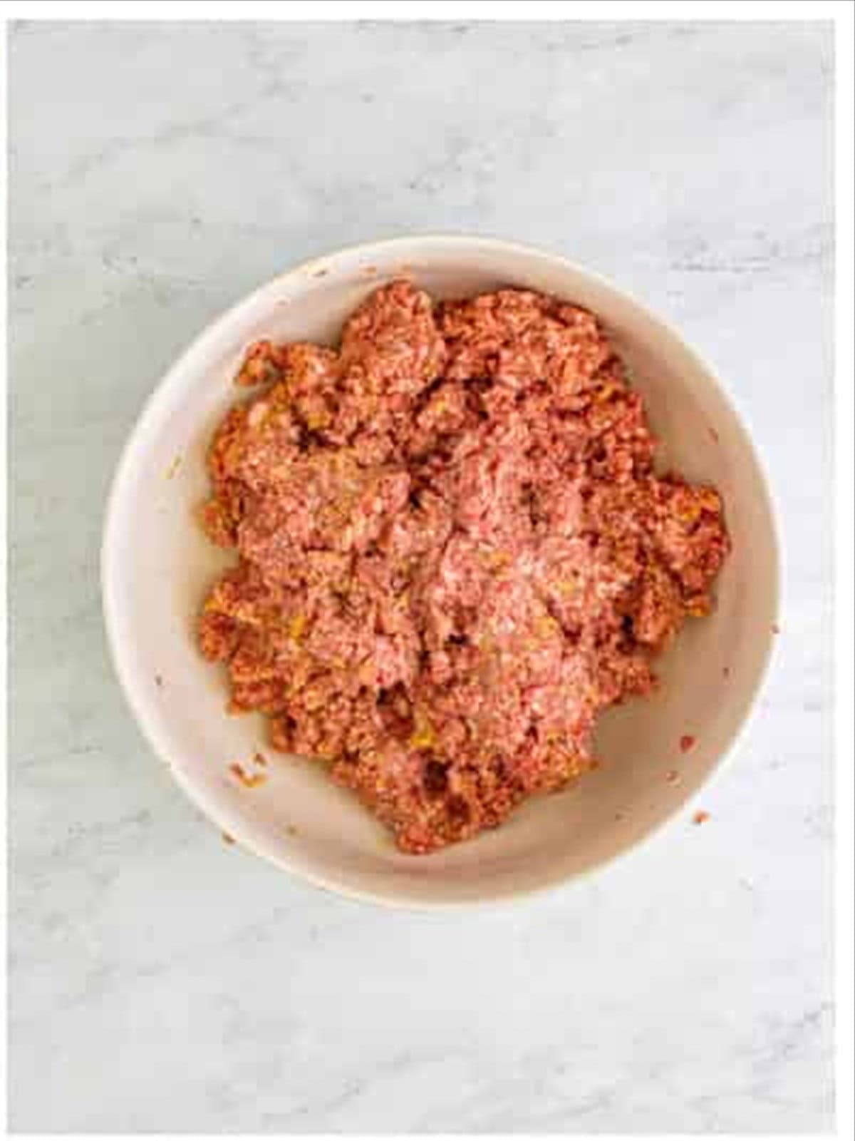 Ground beef and pork mixed for grape jelly meatballs.