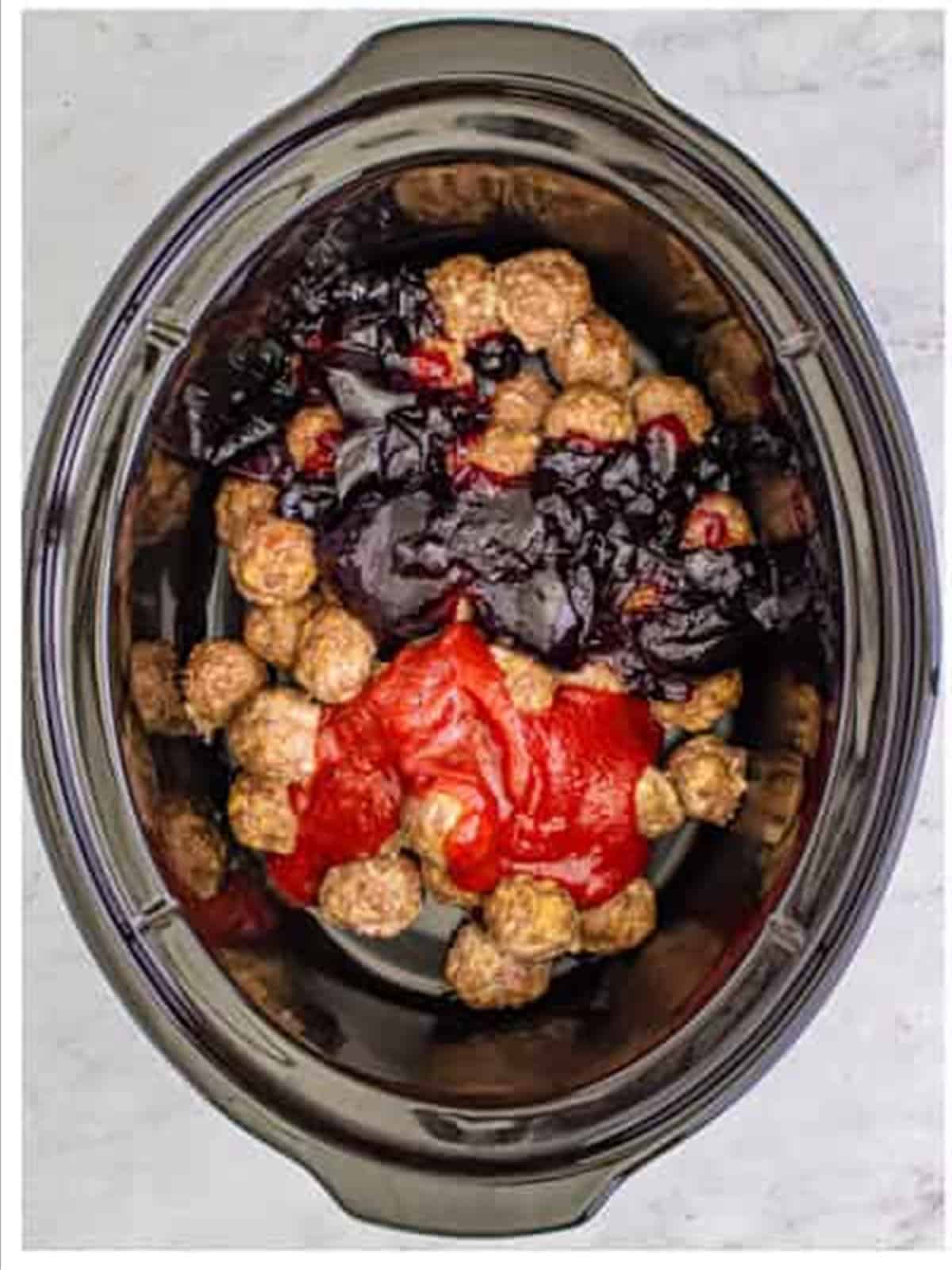 Adding grape jelly and chili sauce to the meatballs in the slow cooker.