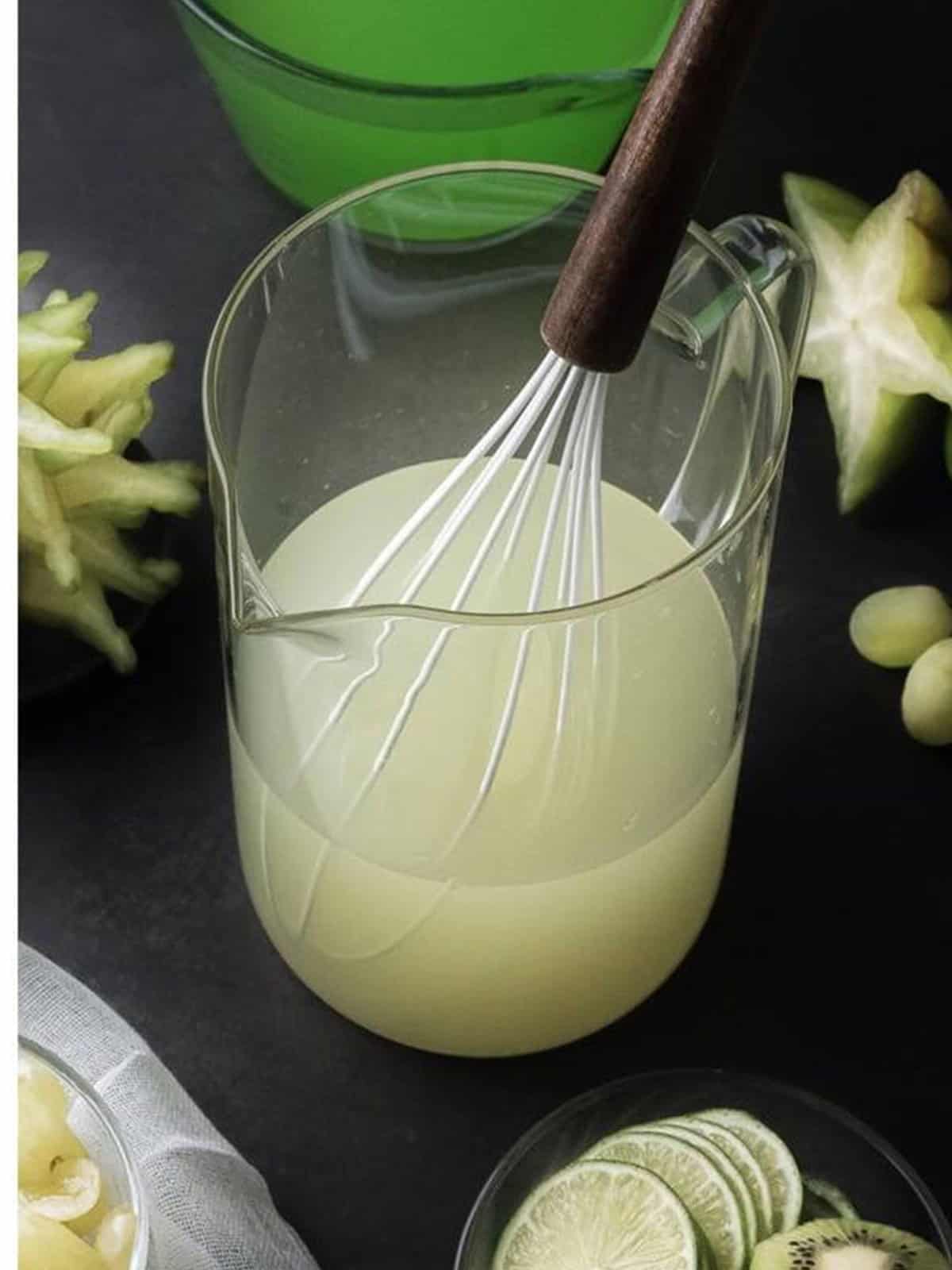 Lemonade and water whisked together until dissolved for green punch.