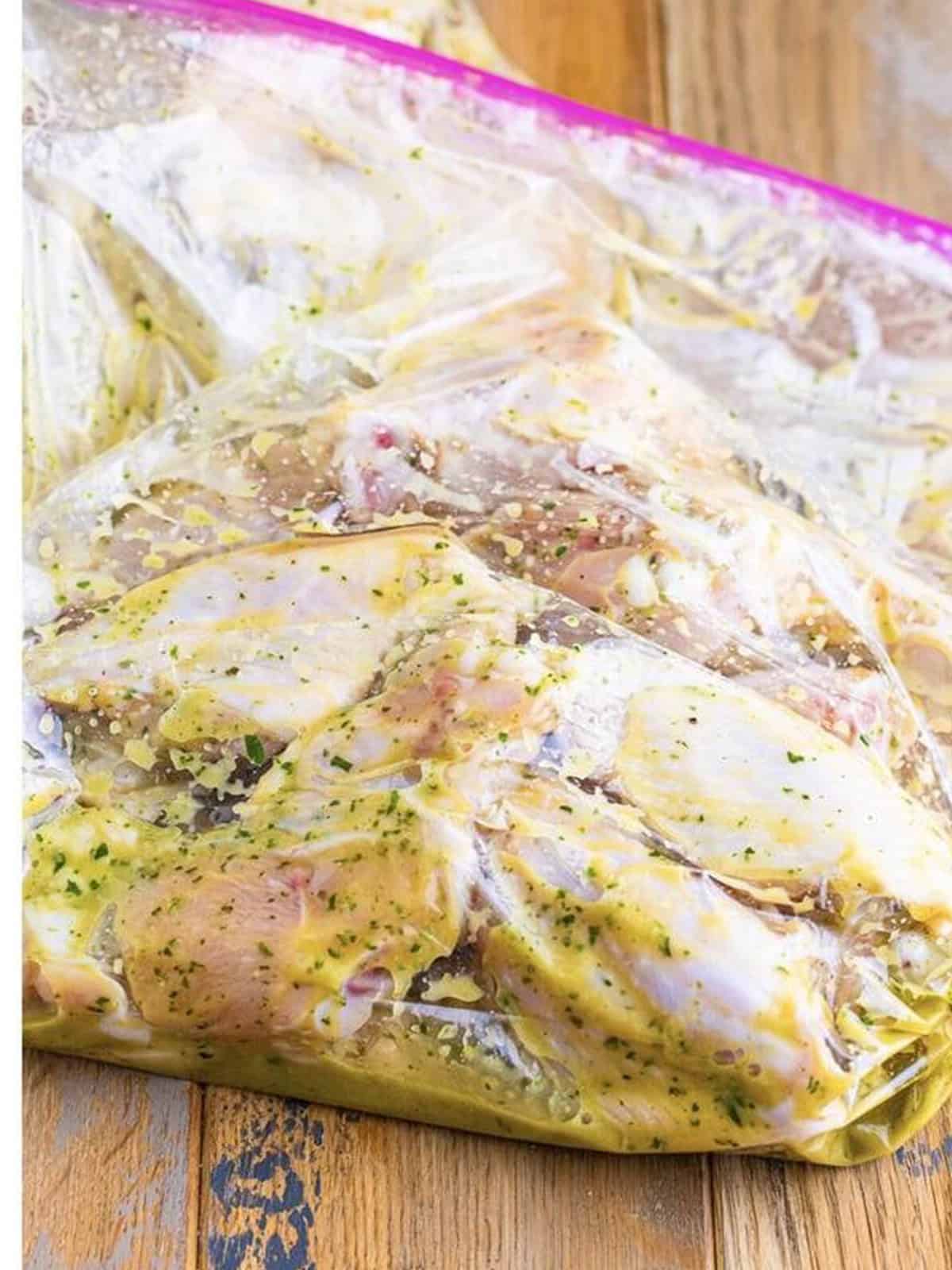 Chicken wings marinating in the key lime marinade in a zip top bag.