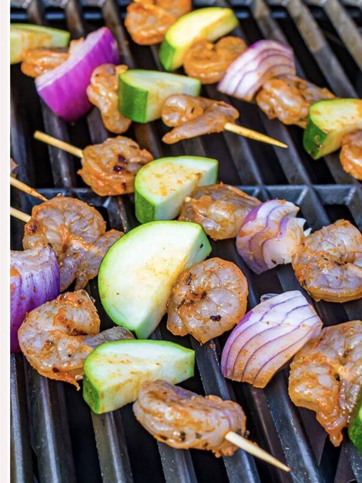 Grilled shrimp skewers cooking on the grill.
