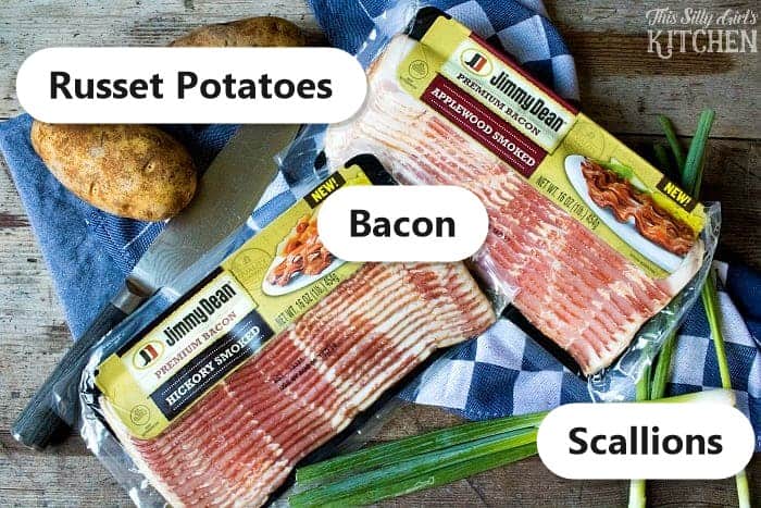 Labeled ingredients for fully loaded hasselback potatoes including russet potatoes, bacon, and scallions.