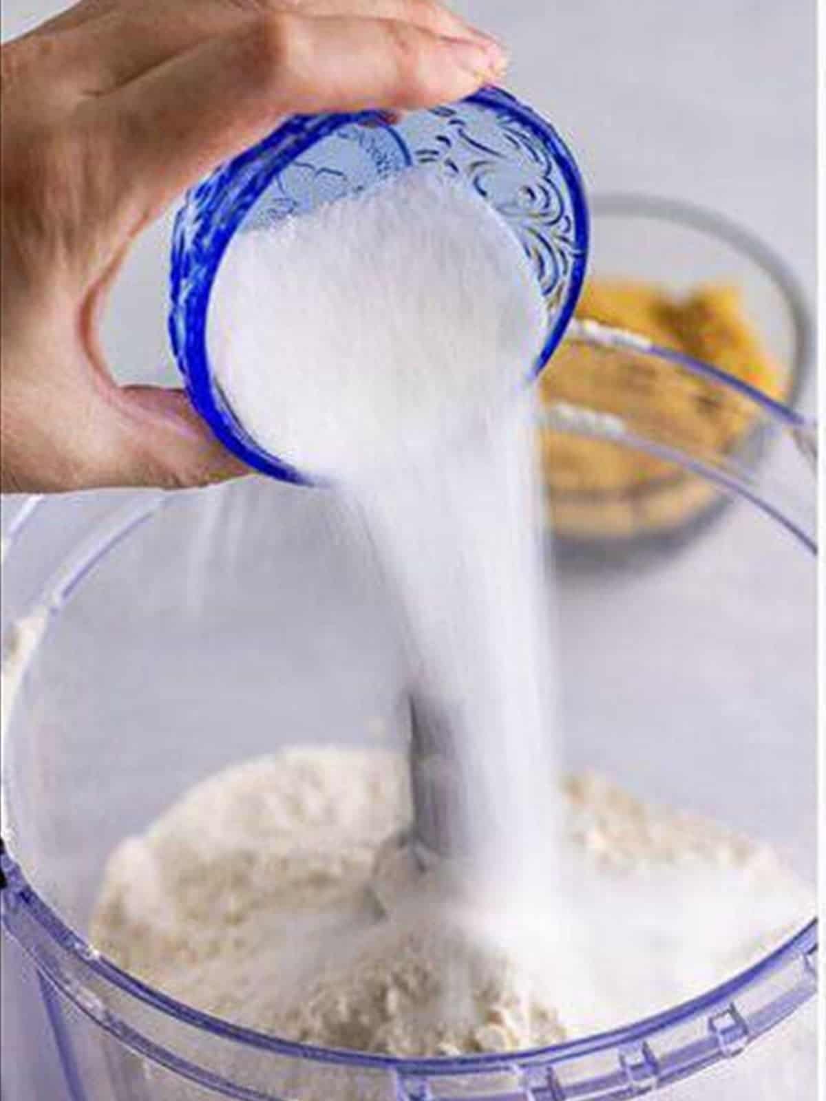 Pulsing flour and sugar in a food processor for homemade pop tarts.