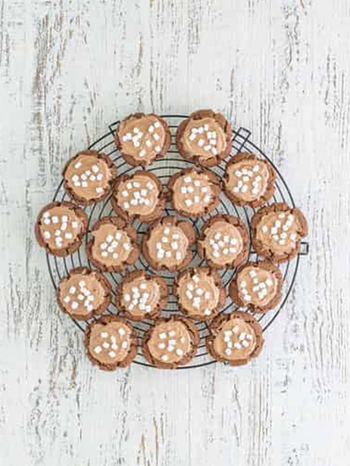 Baked hot chocolate cookies cooling on a wire rack.