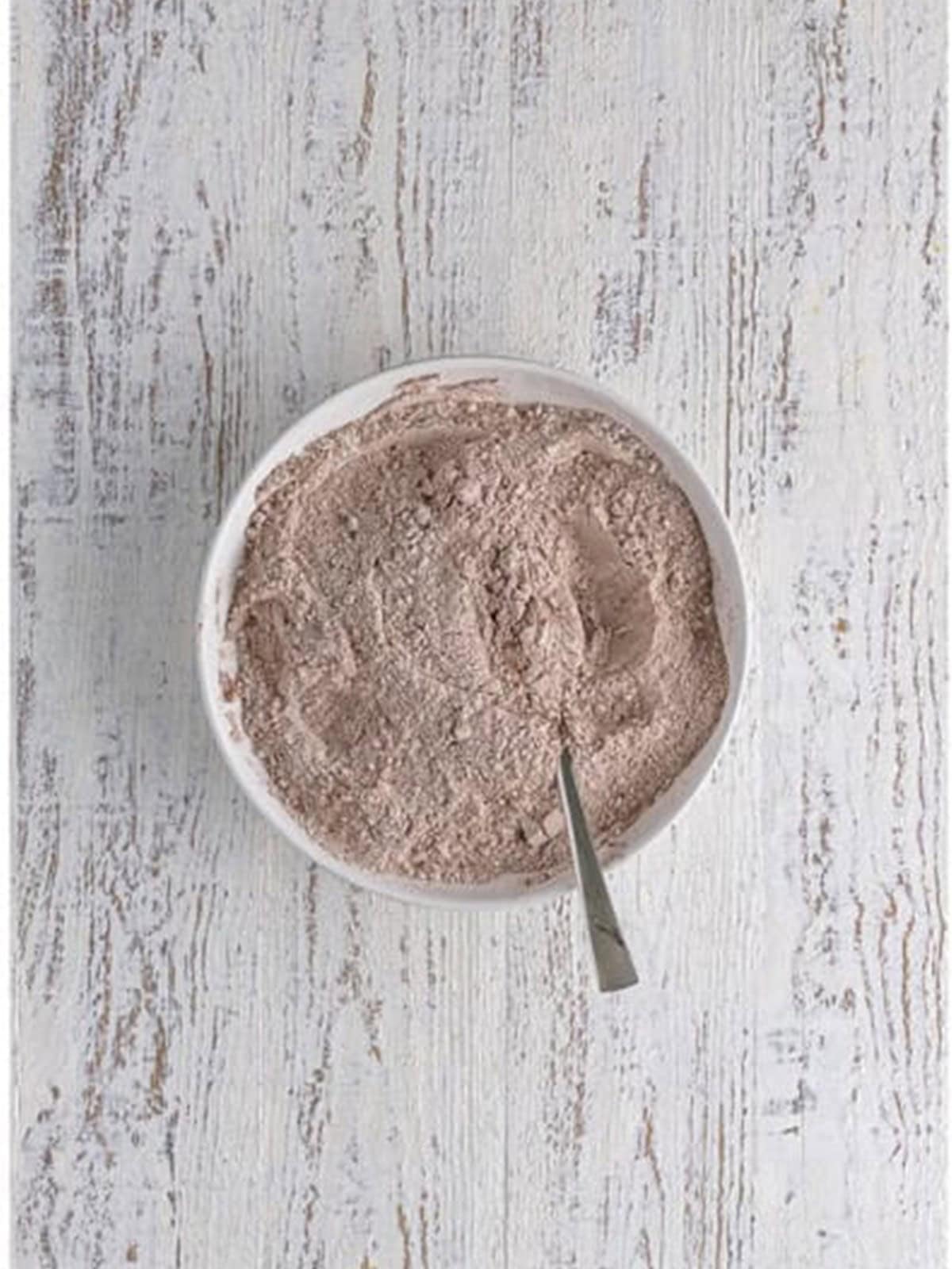 Flour, hot cocoa mix, cocoa powder, and leaveners whisked together in a mixing bowl.