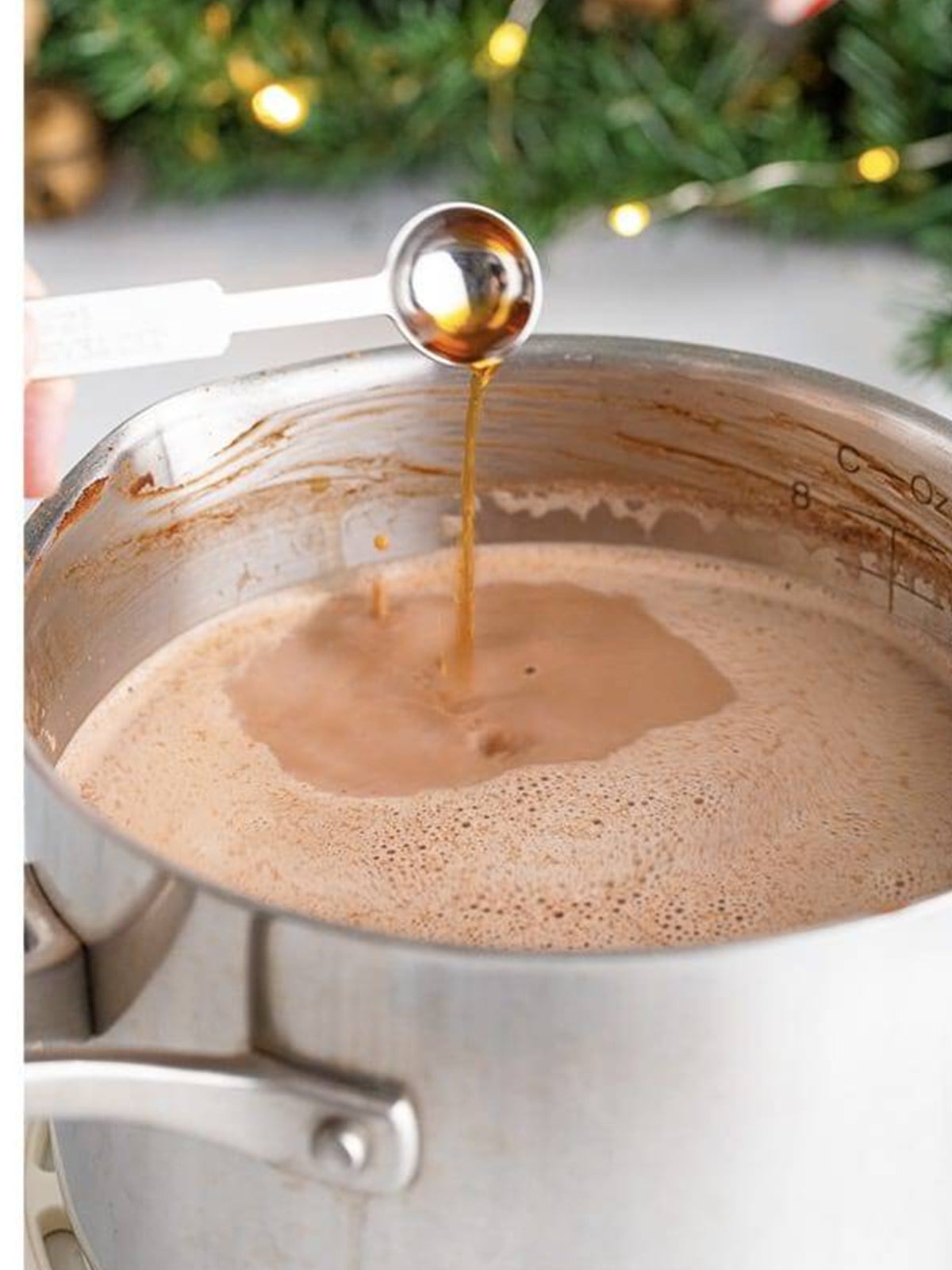 Hot chocolate mixture heated and whisked to scalding in a saucepan.