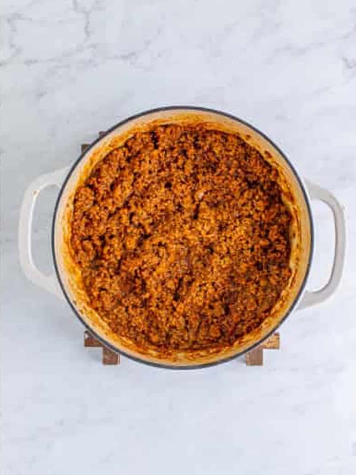 Hot dog chili simmered and reduced into a thick finely ground sauce.