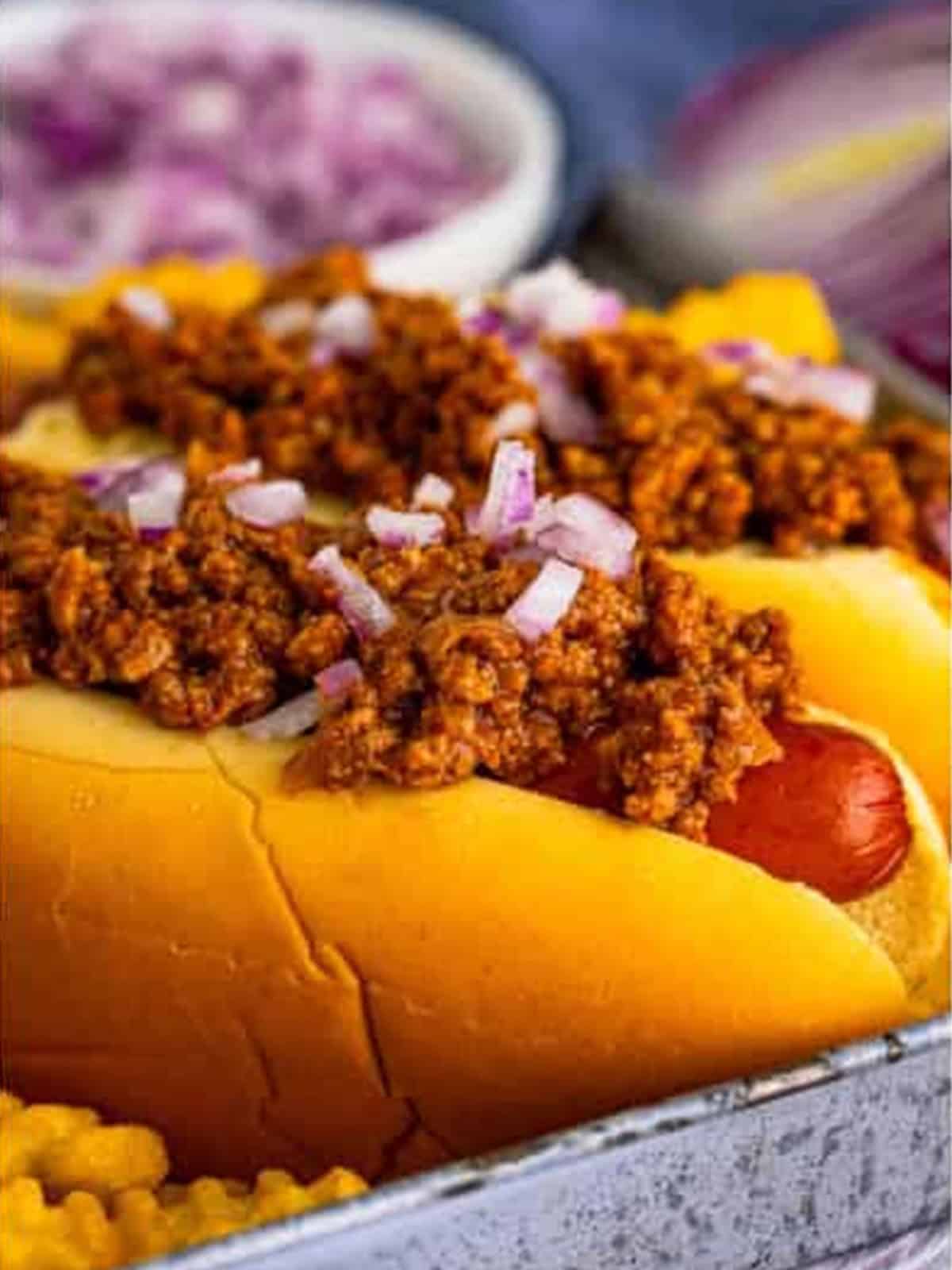 New York style hot dog chili served over hot dogs with diced onion.