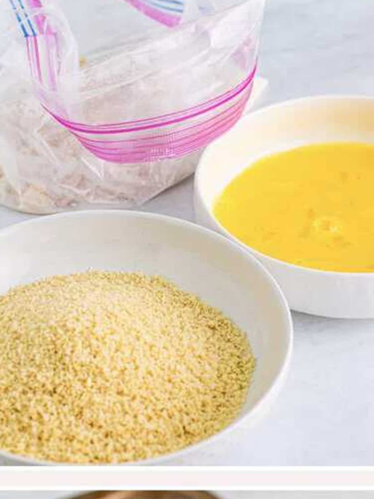 Chicken tenders tossed with seasoned flour in a plastic bag for Hot Honey Chicken.