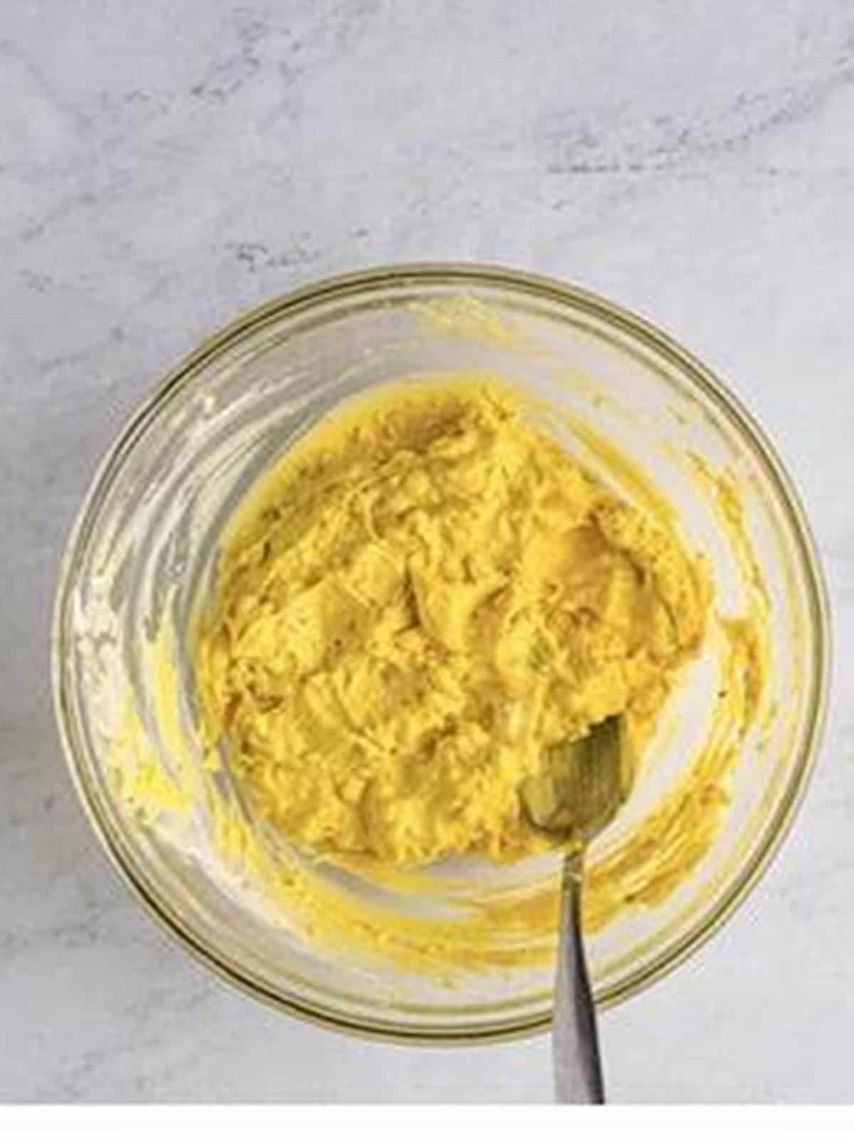 Smooth jalapeno deviled egg filling mixed in a bowl.