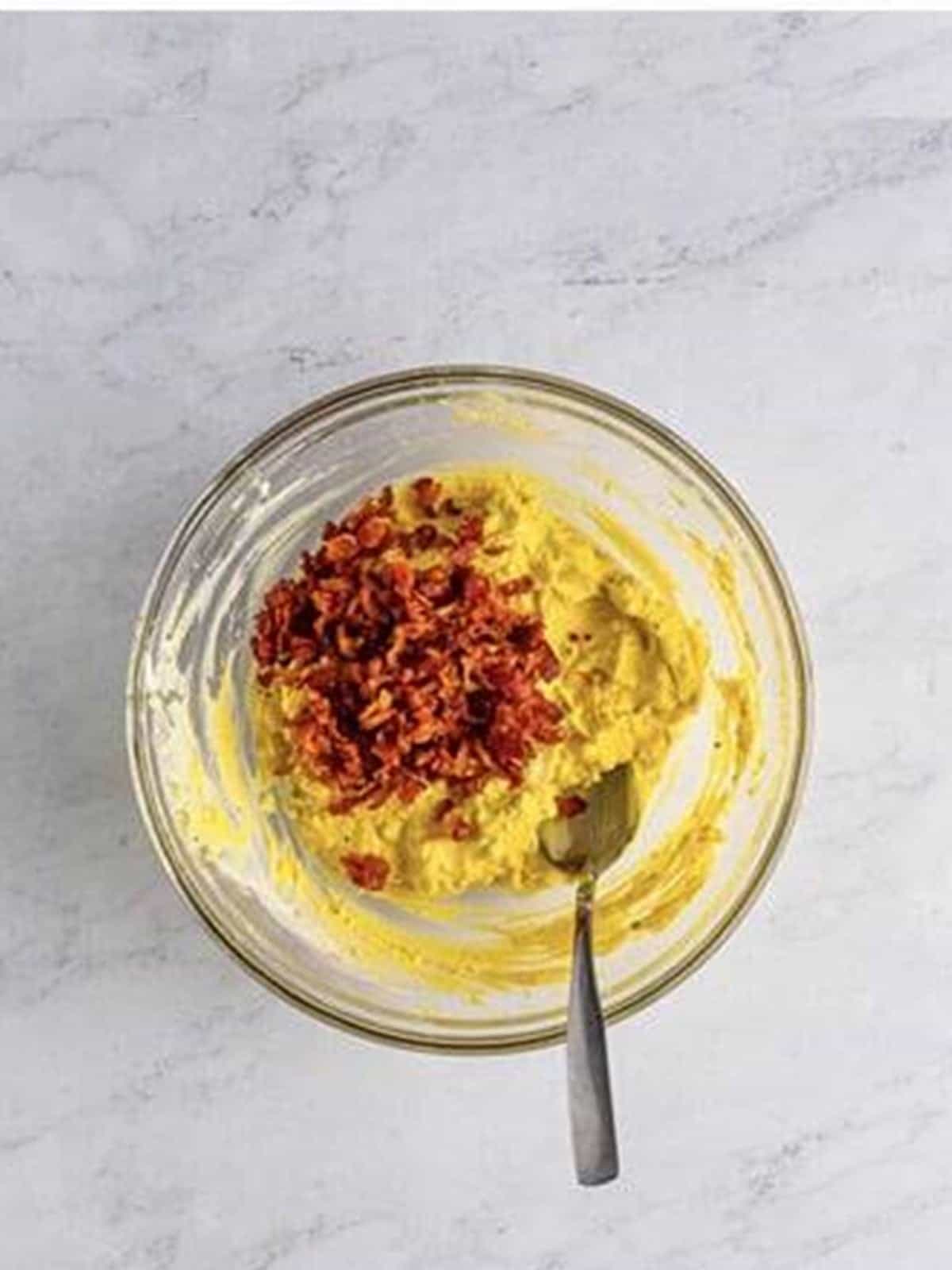 Chopped crispy bacon added to the deviled egg filling.