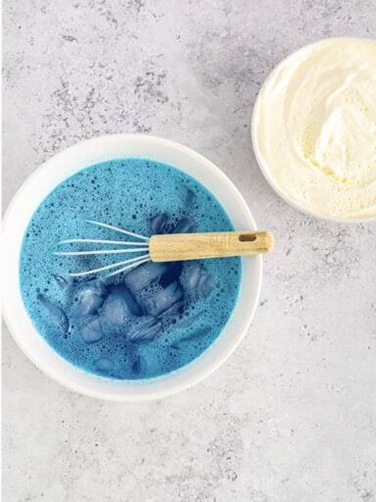 Ice water whisked into the dissolved blue jello to cool it quickly.