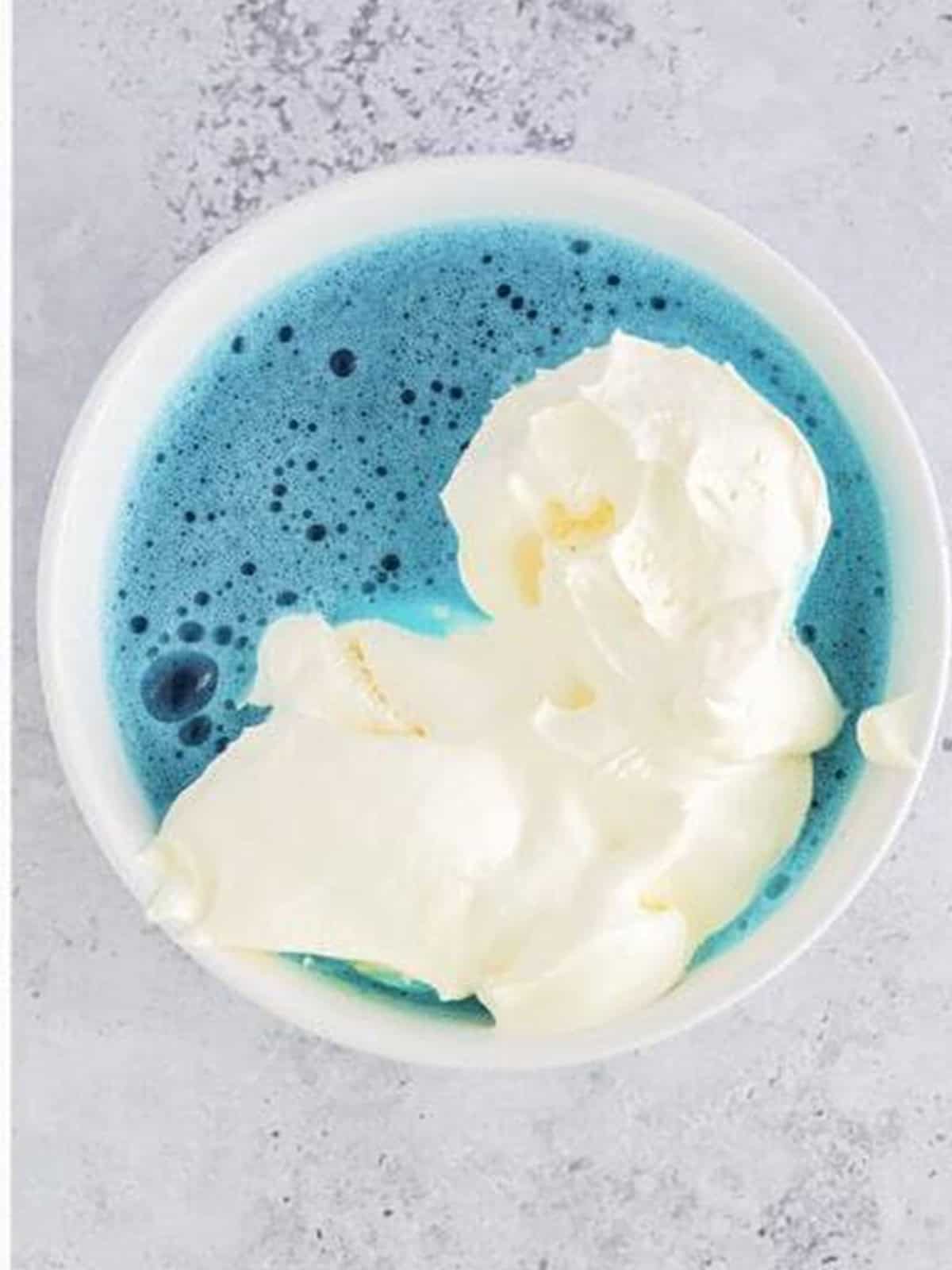 Whipped topping whisked into the blue jello mixture before chilling.