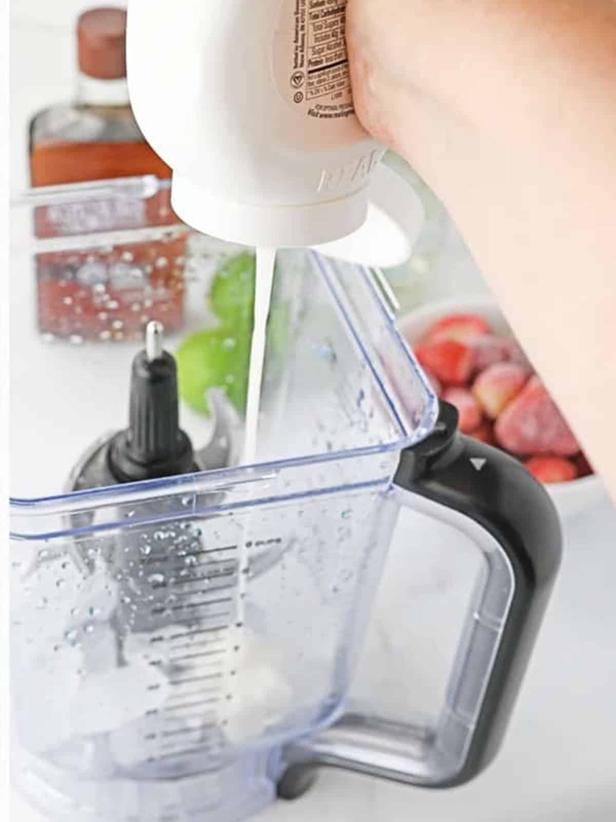 Cream of coconut white margarita layer being blended.
