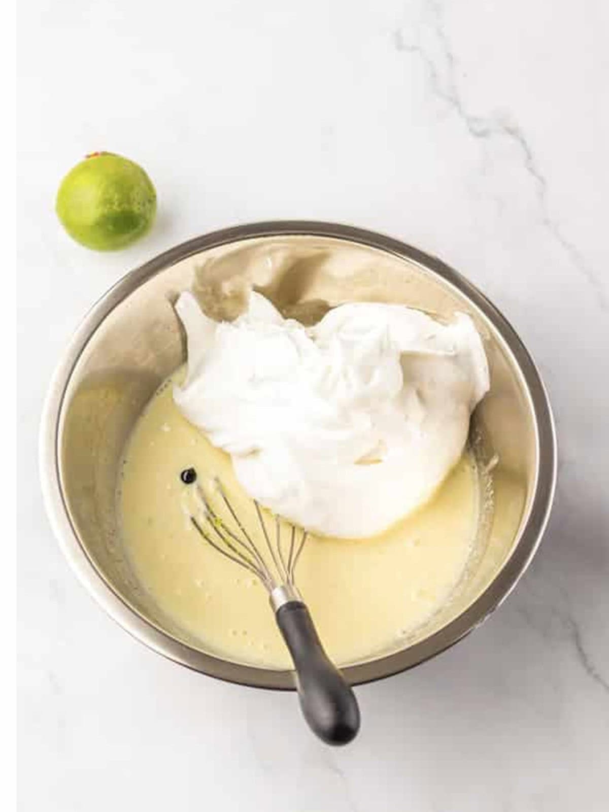 Whipped topping added to the key lime base for Key Lime Fluff Salad.