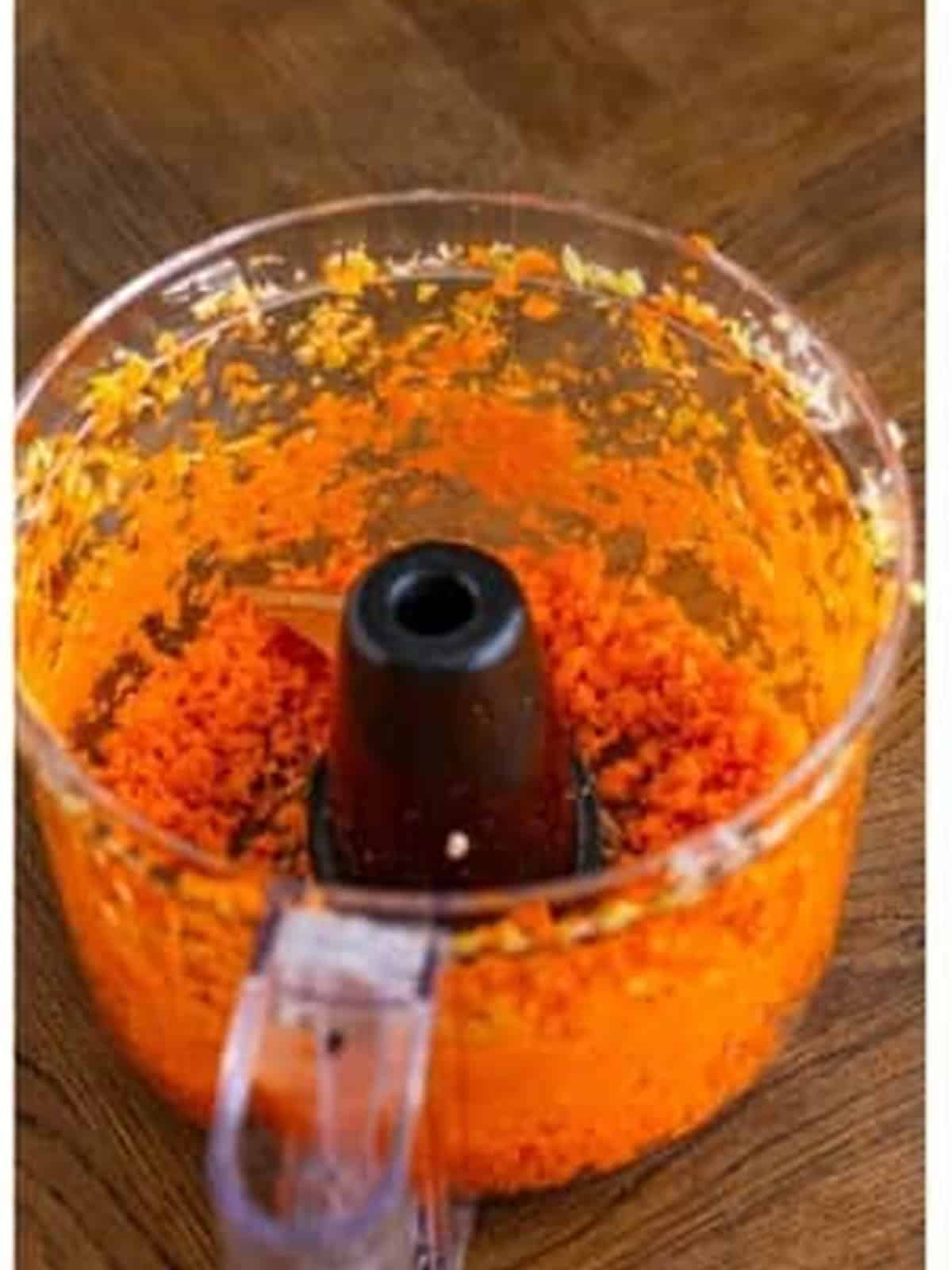 Finely chopped carrots in a food processor.