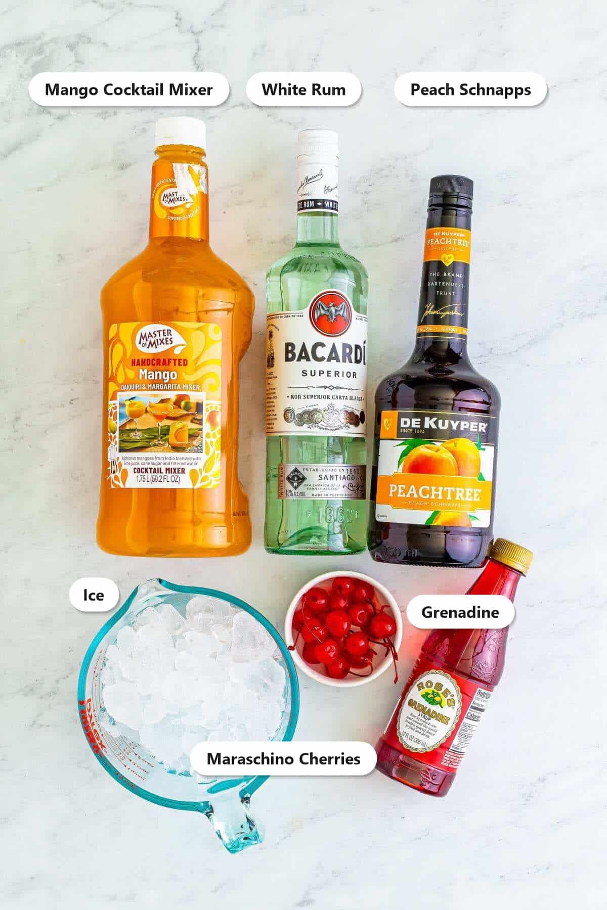Labeled ingredients for the Kiss on the Lips drink including mango cocktail mixer, white rum, peach schnapps, ice, maraschino cherries, and grenadine.