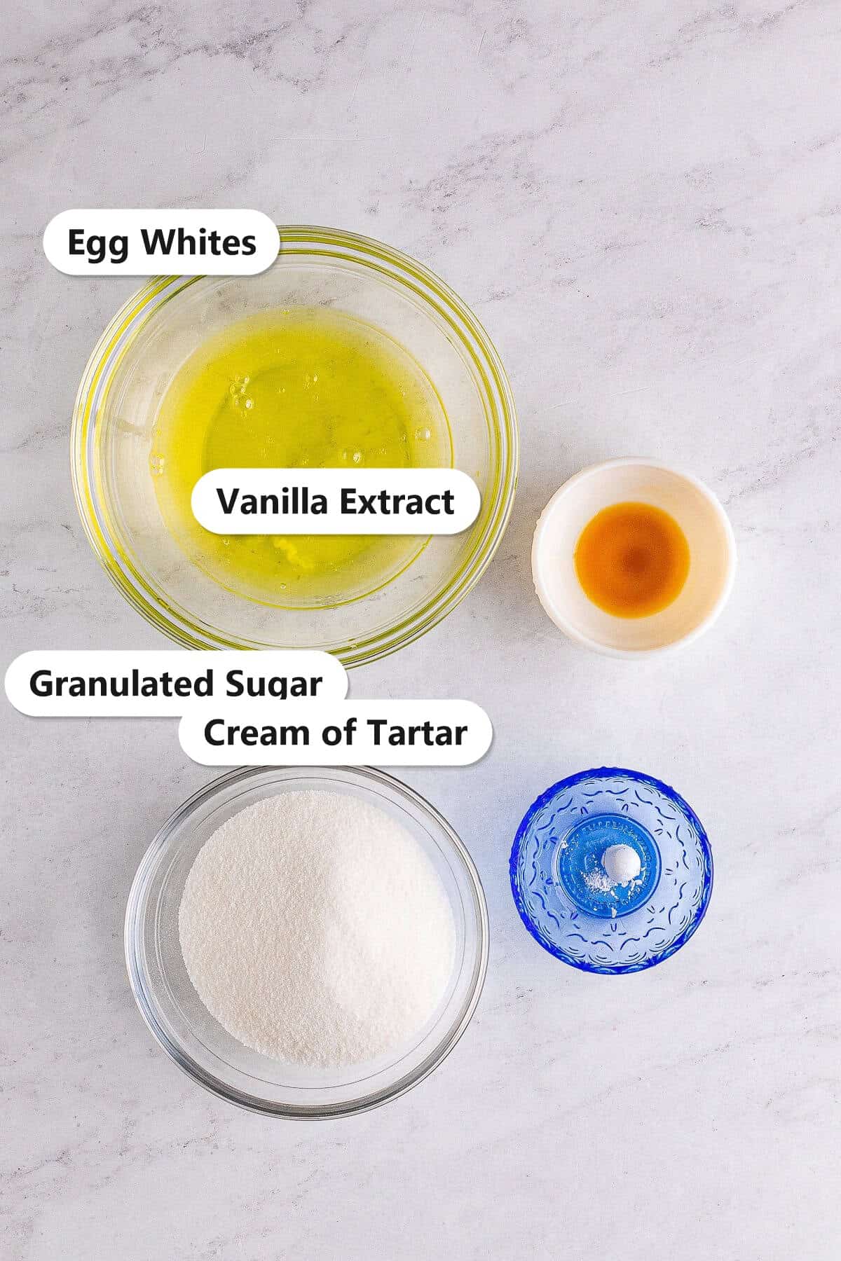 Labeled Meringue Cookies ingredients including egg whites, granulated sugar, vanilla extract, and cream of tartar.