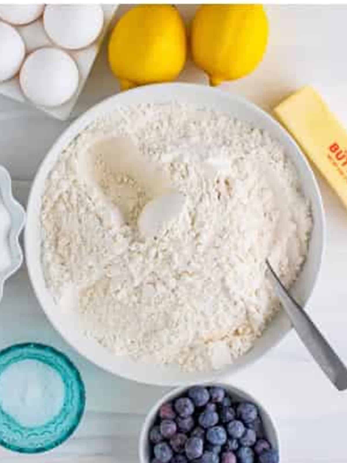 Dry ingredients whisked together in a bowl for lemon blueberry coffee cake.